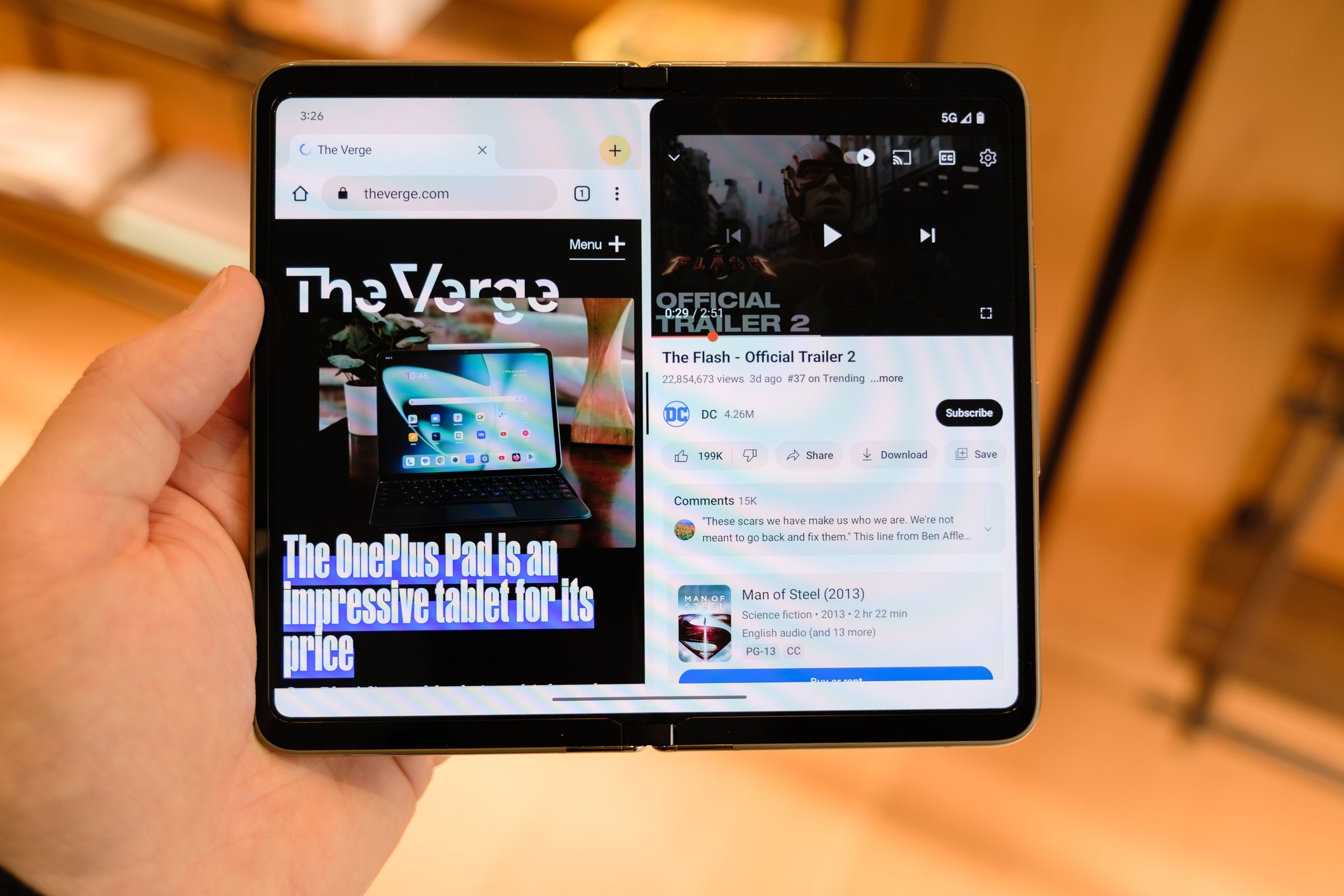 A Pixel Fold with both a browser and the YouTube app open at the same time in split-screen mode.