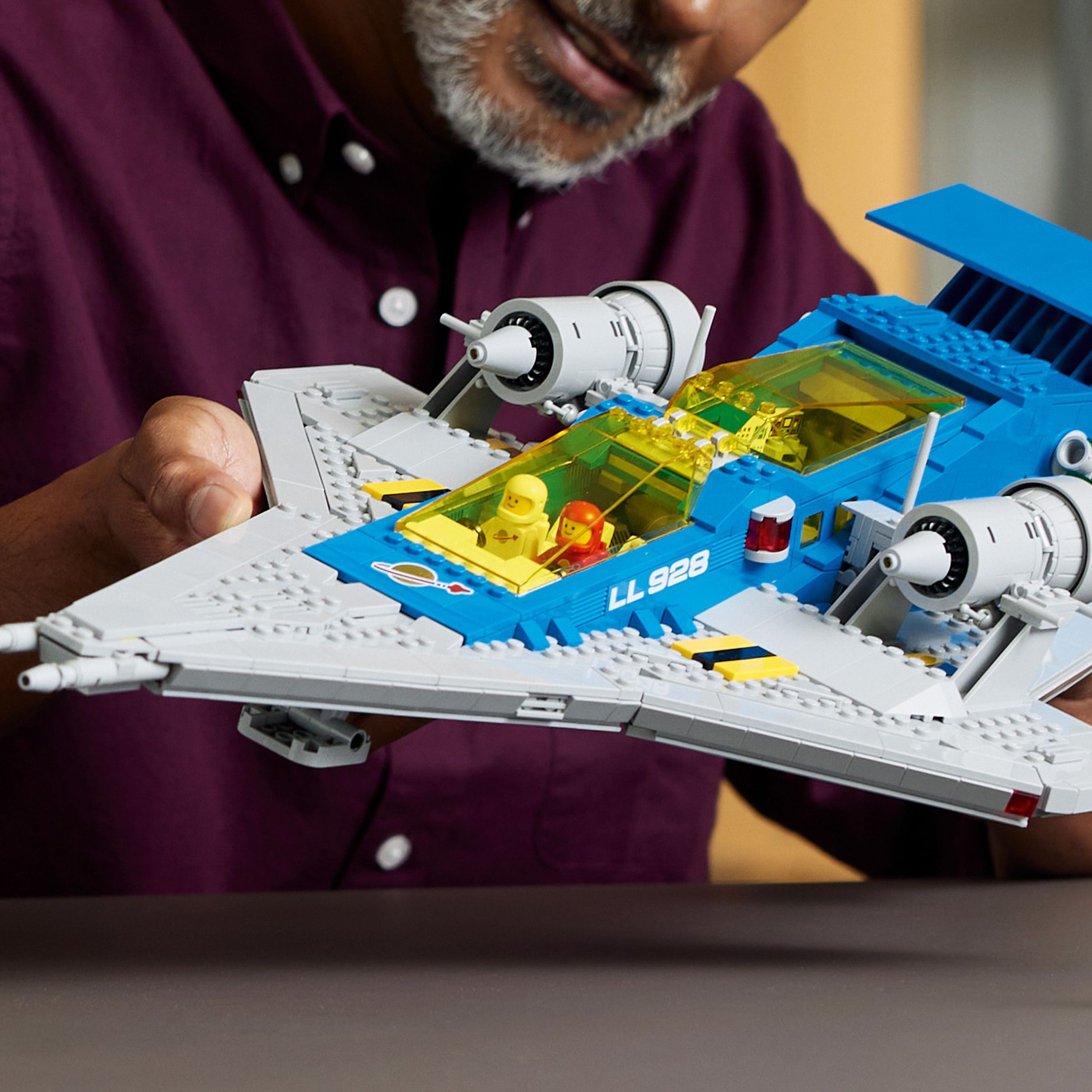 Lego’s Galaxy Explorer is a very large grey and blue spaceship with yellow translucent cockpits and lots of play features.
