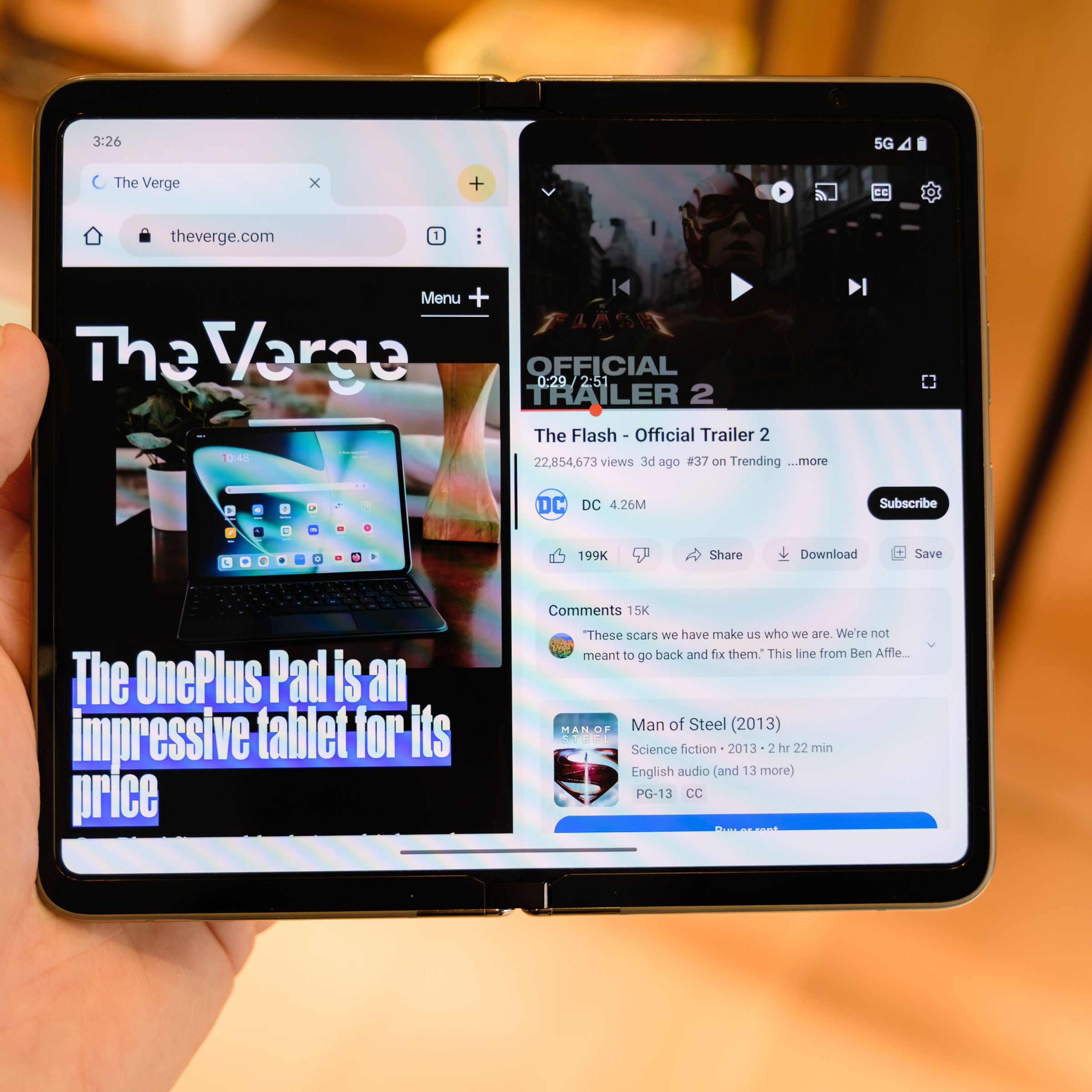 A Pixel Fold with both a browser and the YouTube app open at the same time in split-screen mode.