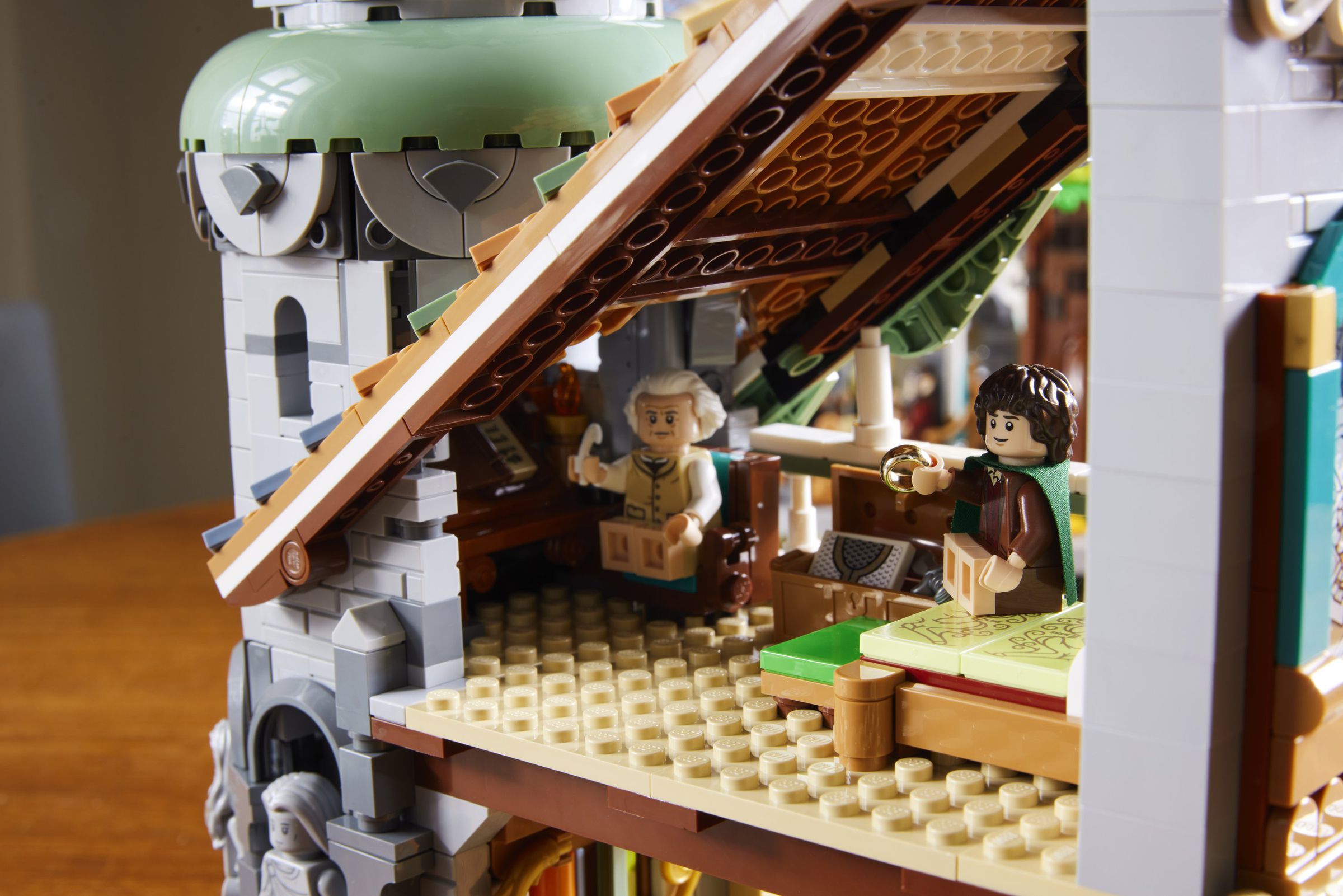 Image of Lego Bilbo and Frodo sitting in a room.