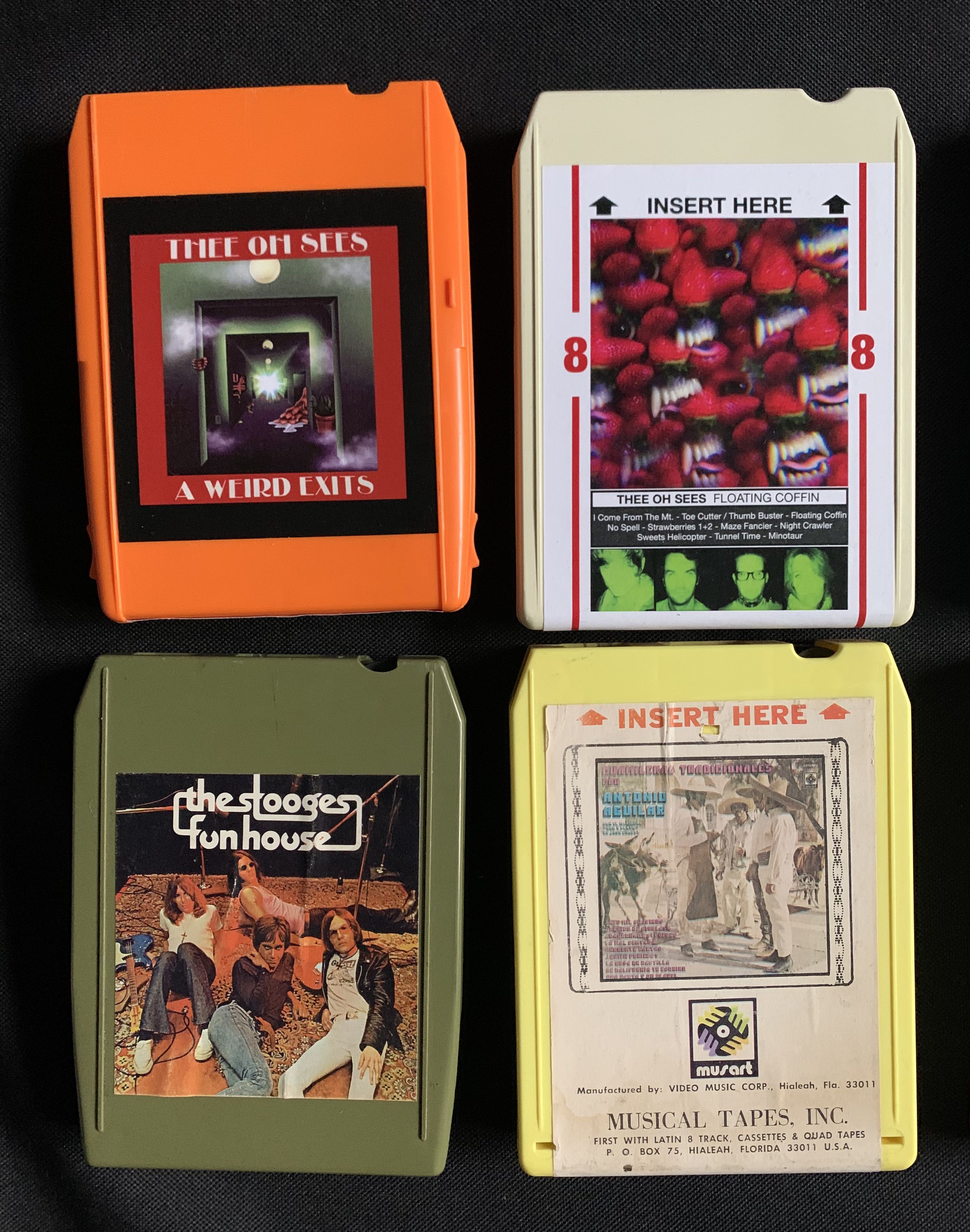 Top: Reconditioned 8-track cartridges with new labels. Botton: Original labeling of other cartridges