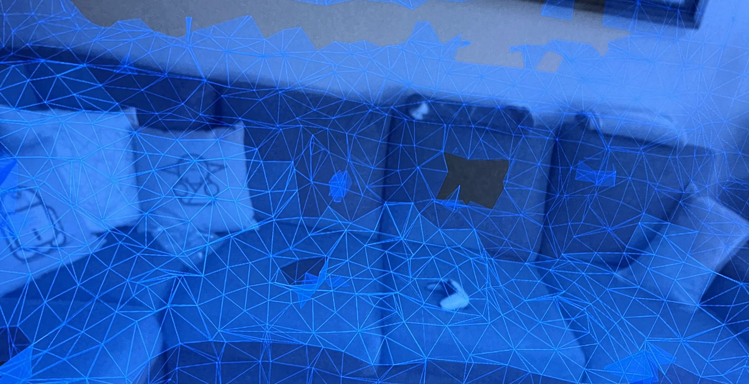 The couch live view is covered in a blue triangular mesh.