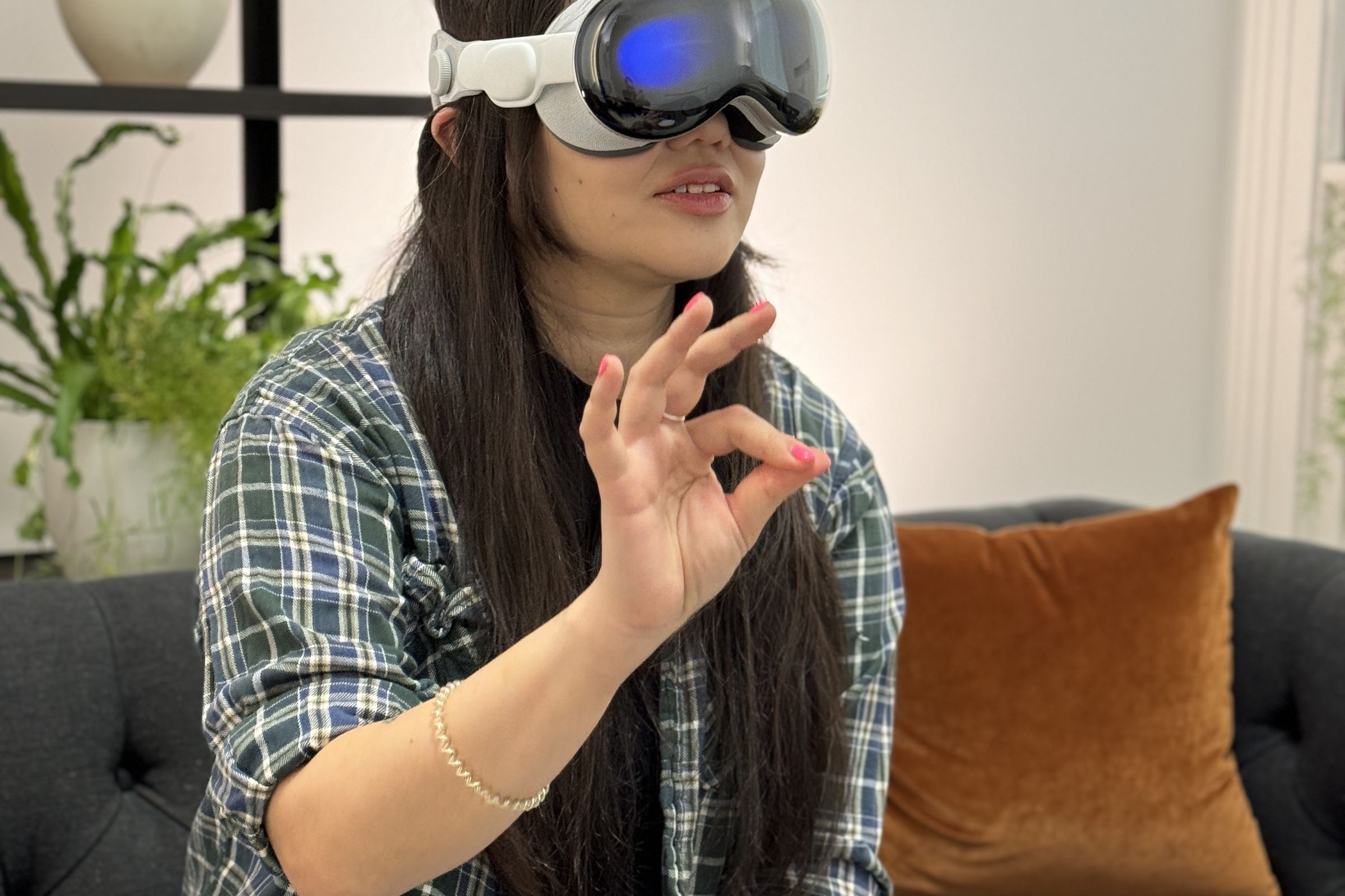 Person wearing Apple Vision Pro while pinching