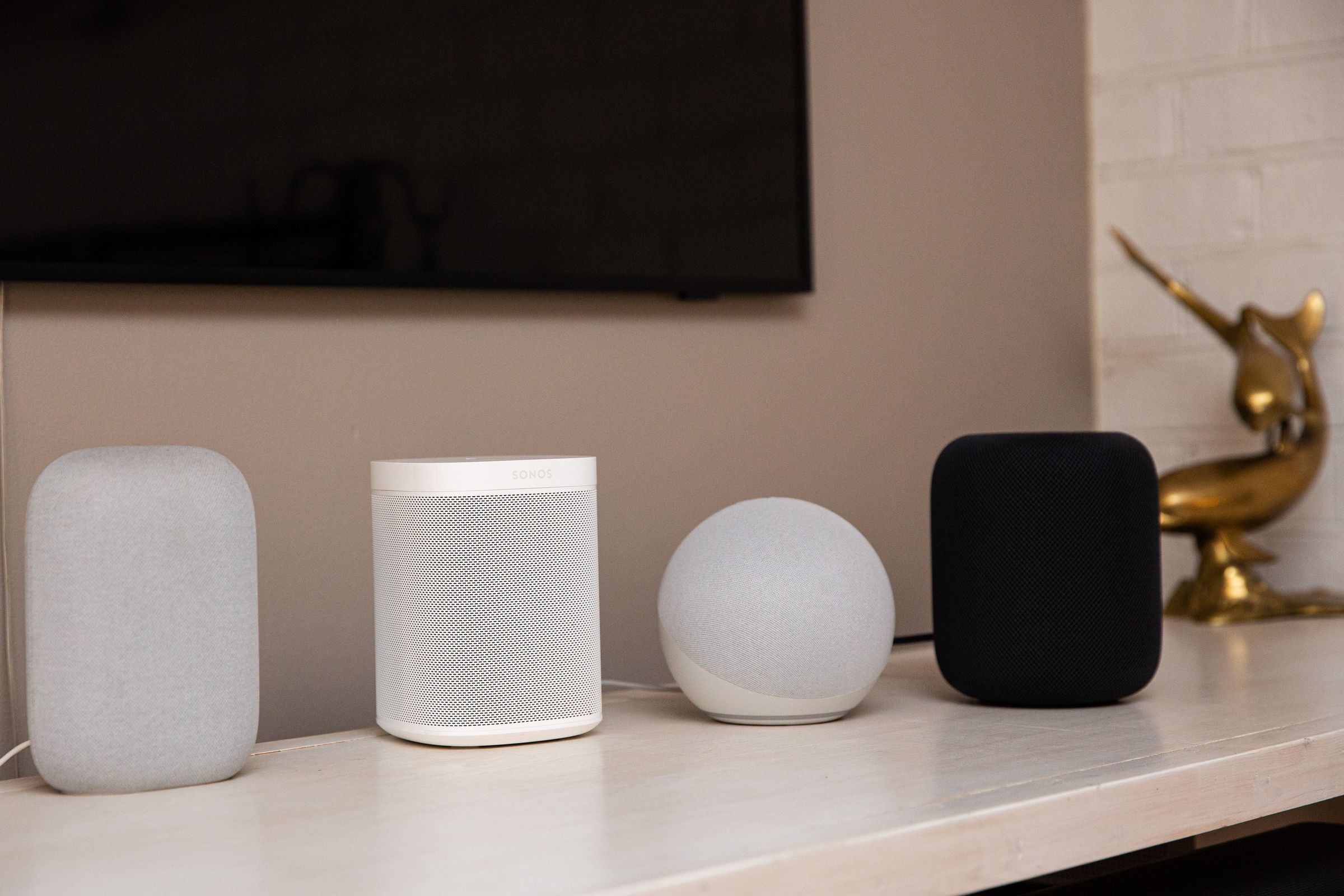 A photo of Apple’s second-gen HomePod beside other smart speakers.