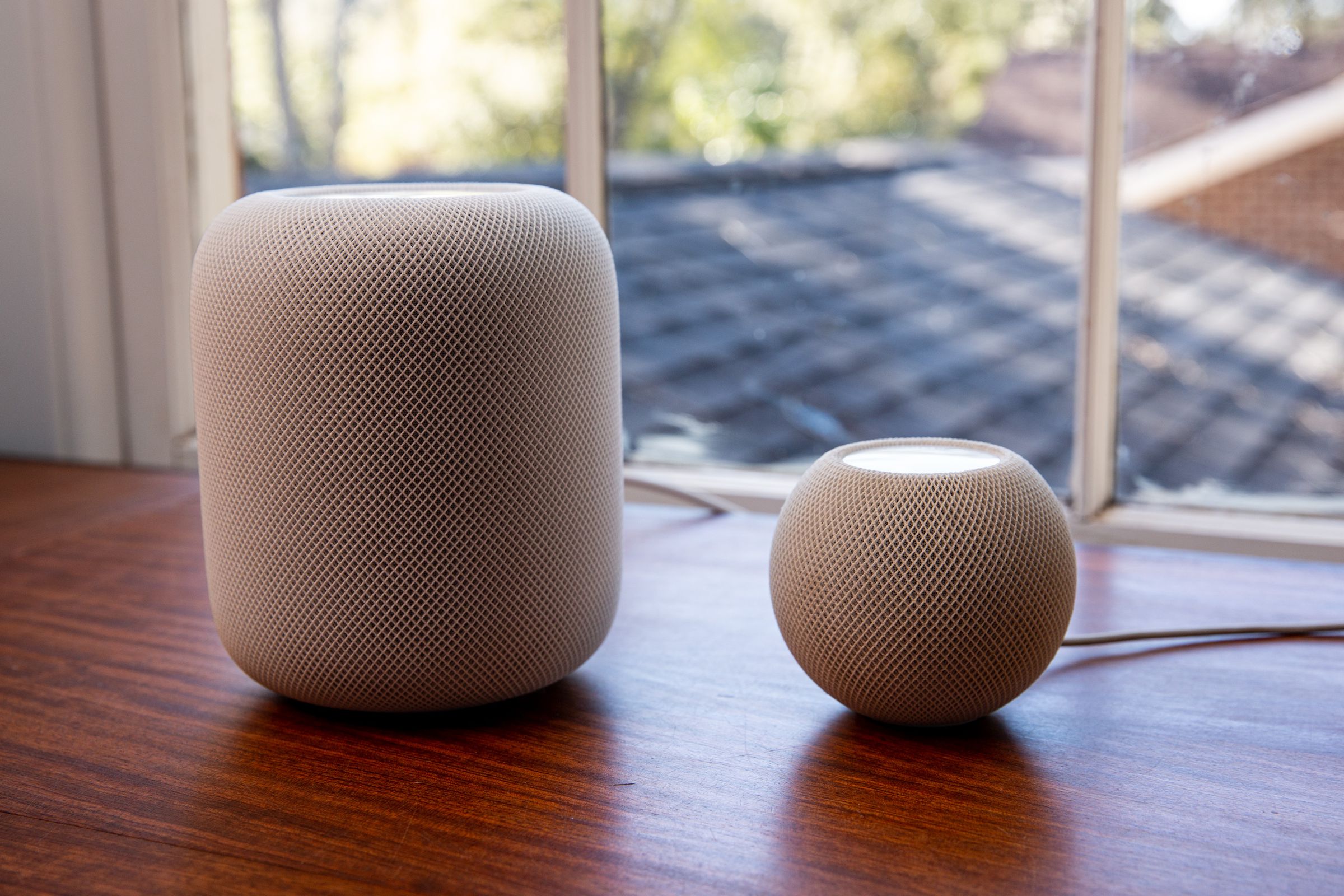 A photo showing Apple’s HomePod (second-gen) and HomePod Mini.