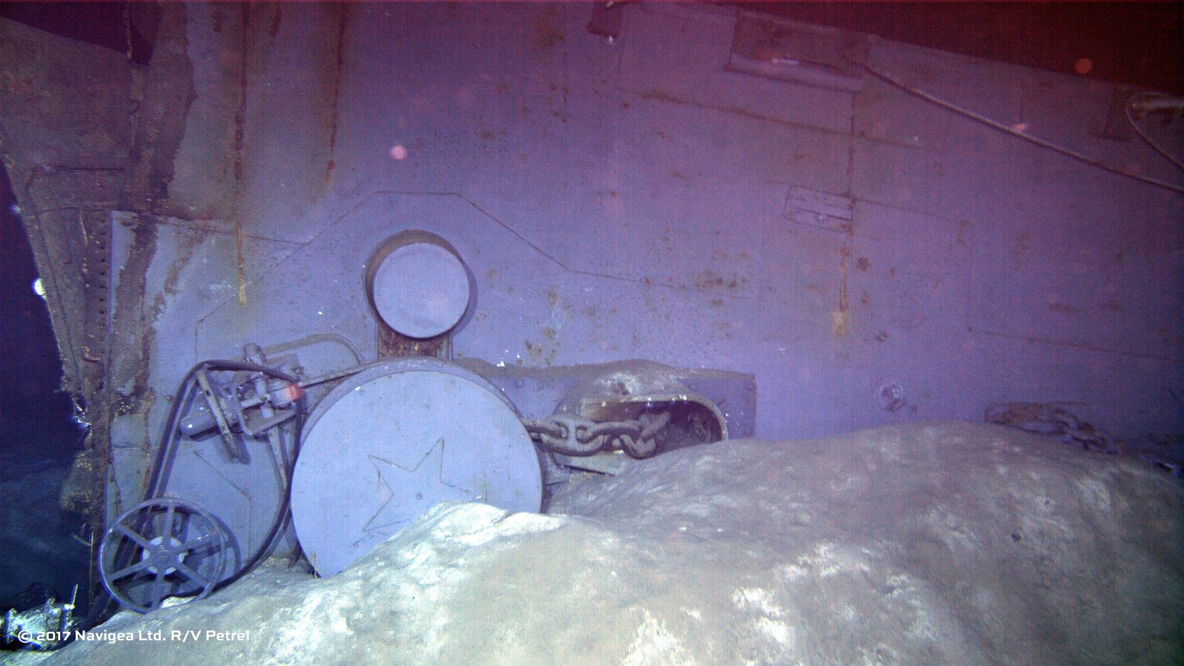 An image shot from a remotely operated vehicle shows wreckage which appears to be one of the two anchor windlass mechanisms from the forecastle of the ship. 