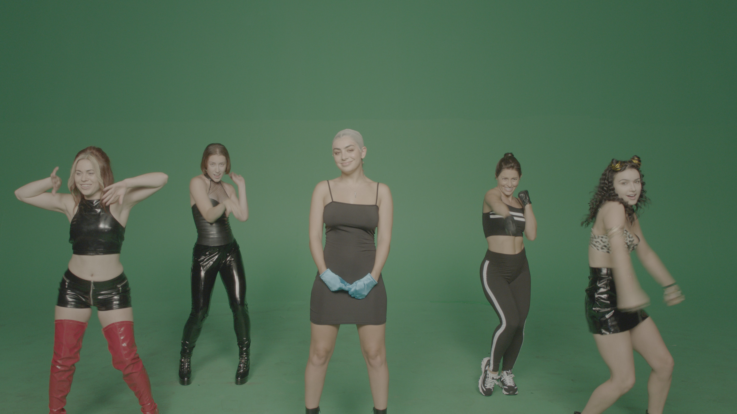 A behind-the-scenes shot showing Charli XCX (center) and dancers imitating members of the Spice Girls. 
