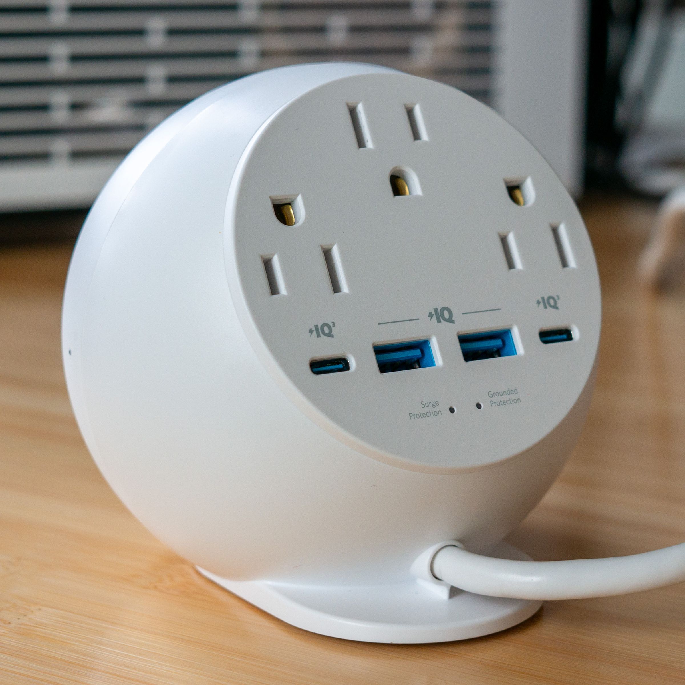 Rear view of the Anker 8-in-1 orb showing three AC outlets, two USB-A, and two USB-C ports.
