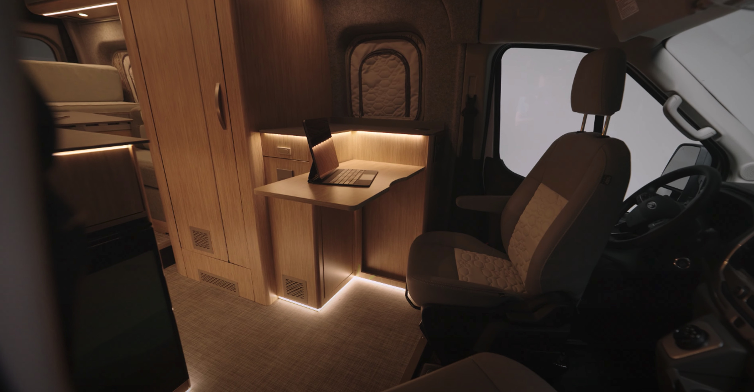 The eRV2 features two customizable workspaces with built-in charging points for digital nomads.
