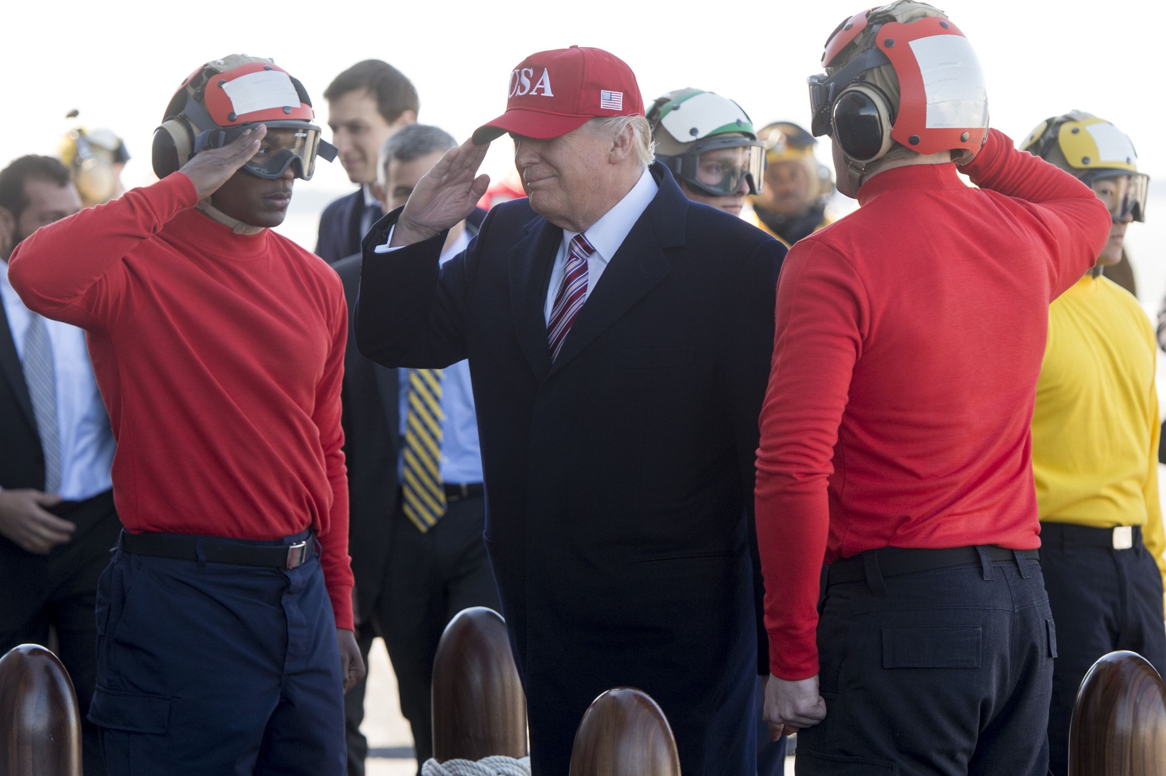 US President Donald Trump arrives onboard the flight deck of the pre-commissioned USS Gerald R. Ford aircraft carrier in Newport News, Virginia, March 2, 2017. / AFP PHOTO / SAUL LOEB