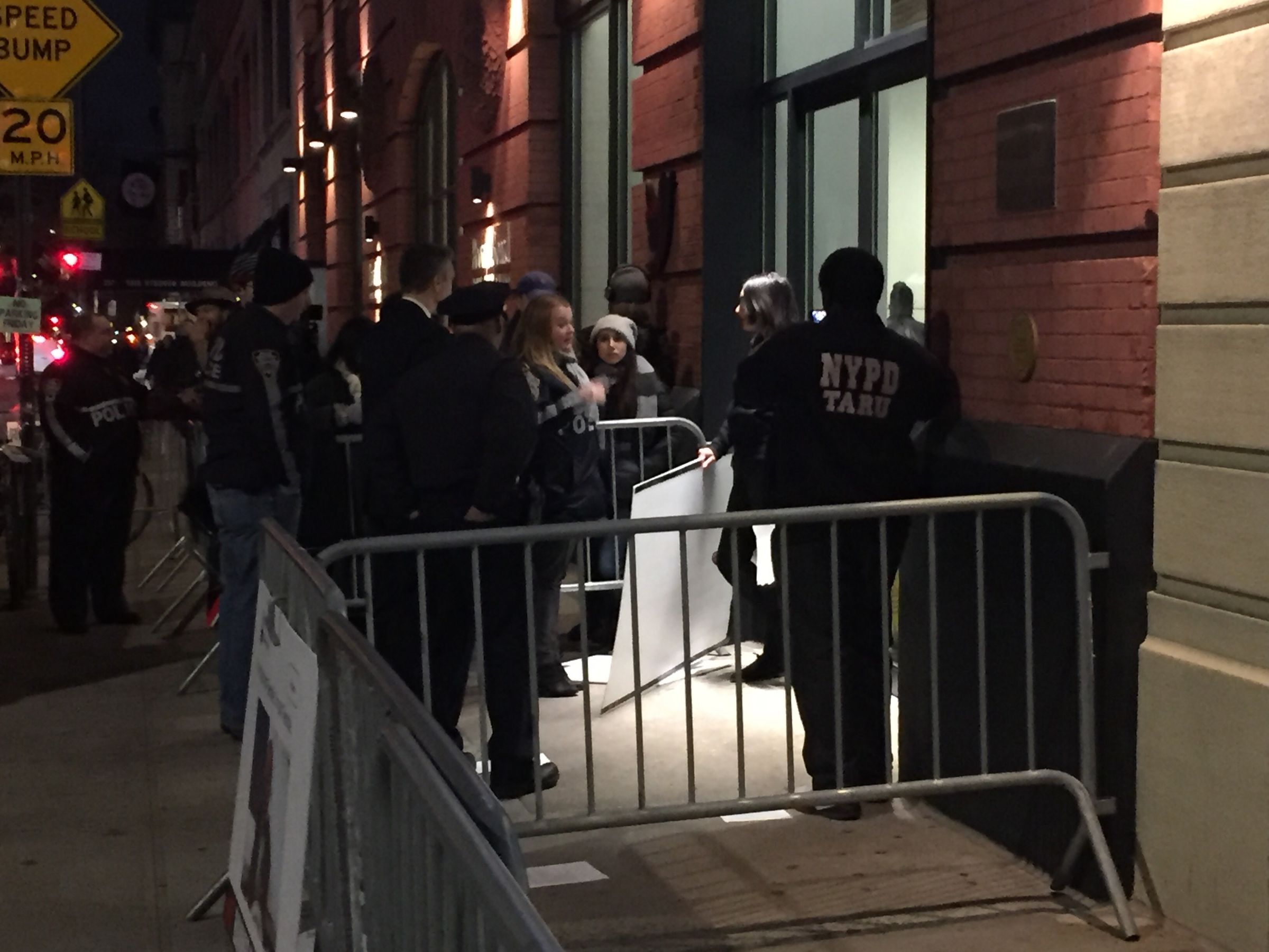 Police negotiate with far-right activist Laura Loomer outside Twitter’s New York headquarters, where she has handcuffed herself.
