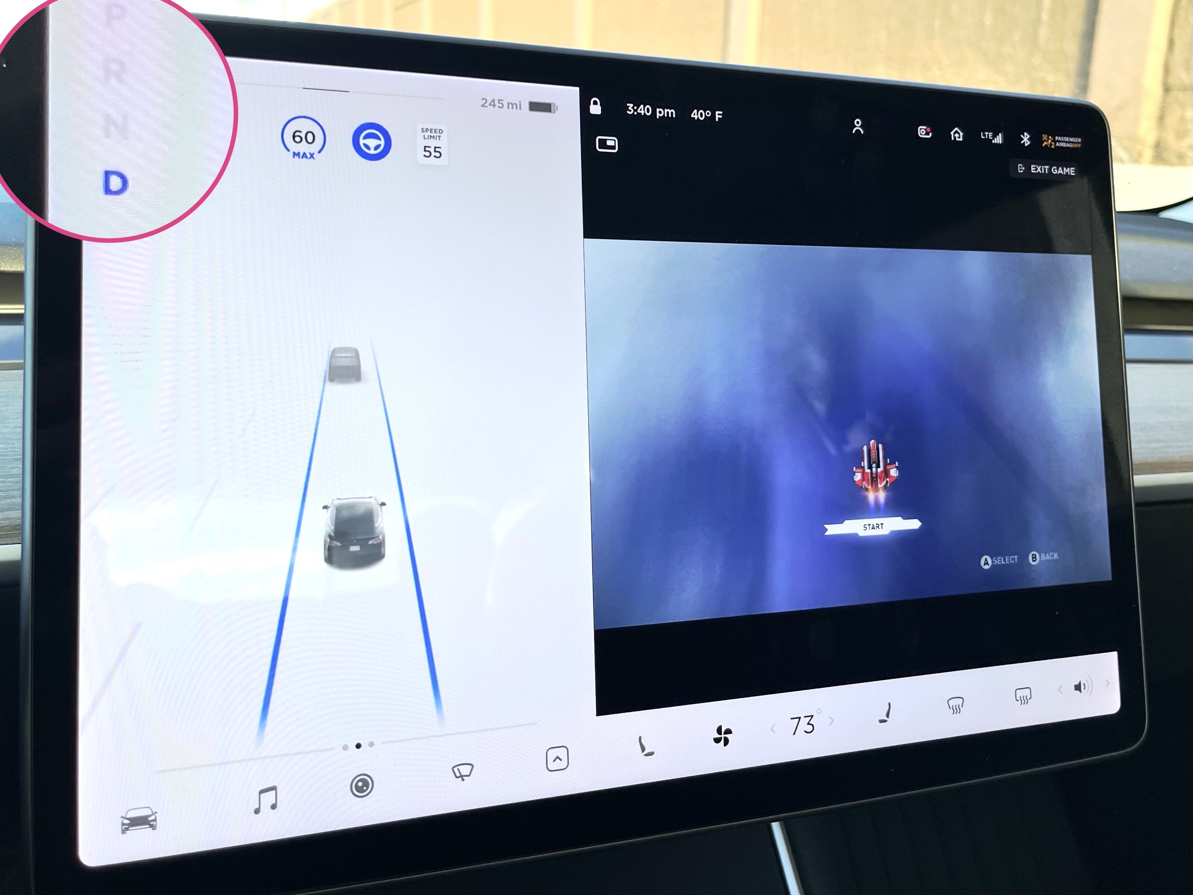 The Tesla center screen is displaying a video game running with a jet craft flying over an ocean, while also displaying the status of the Tesla vehicle in drive and running on autopilot