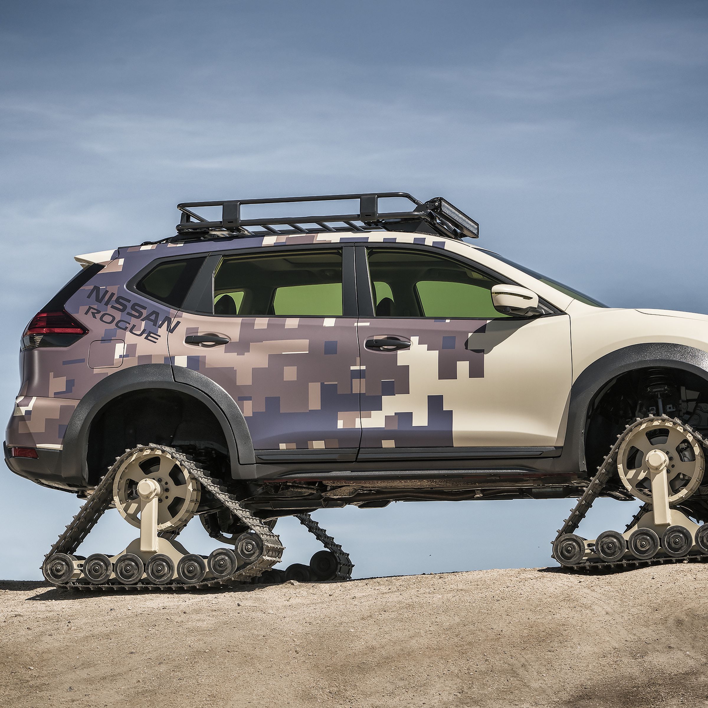 A nissan rogue with tank treads for wheels