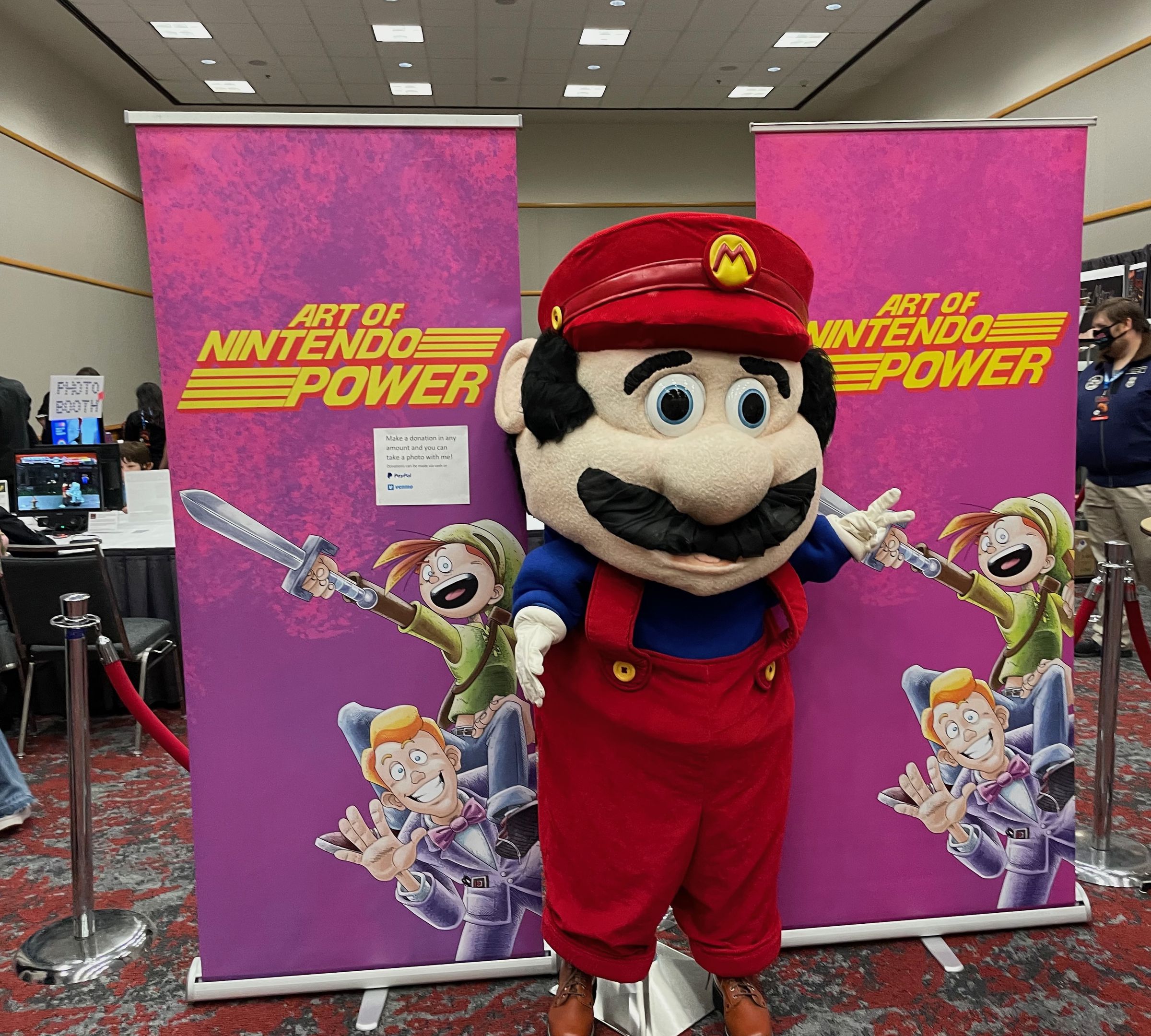 A mascot costume of Mario at the “Art of Nintendo Power” exhibit.
