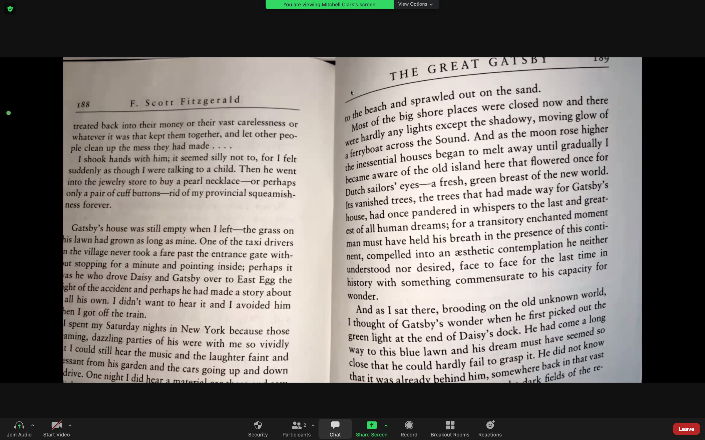 Top-down view of a printed book, shown in a Zoom call