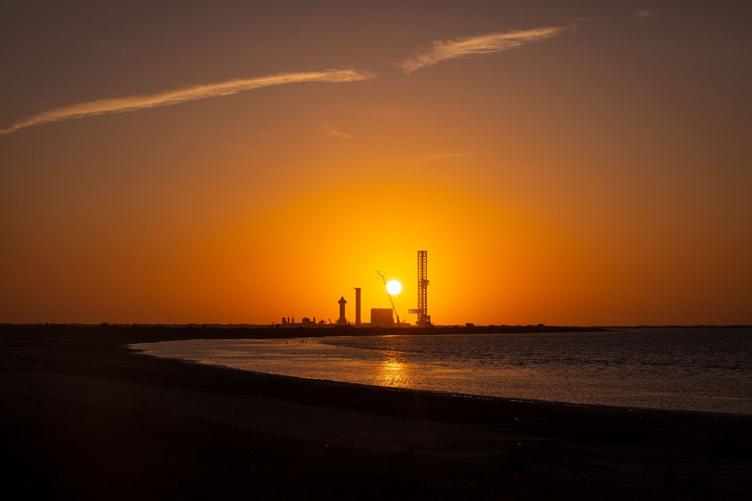 Sunrise behind SpaceX’s launch facility.