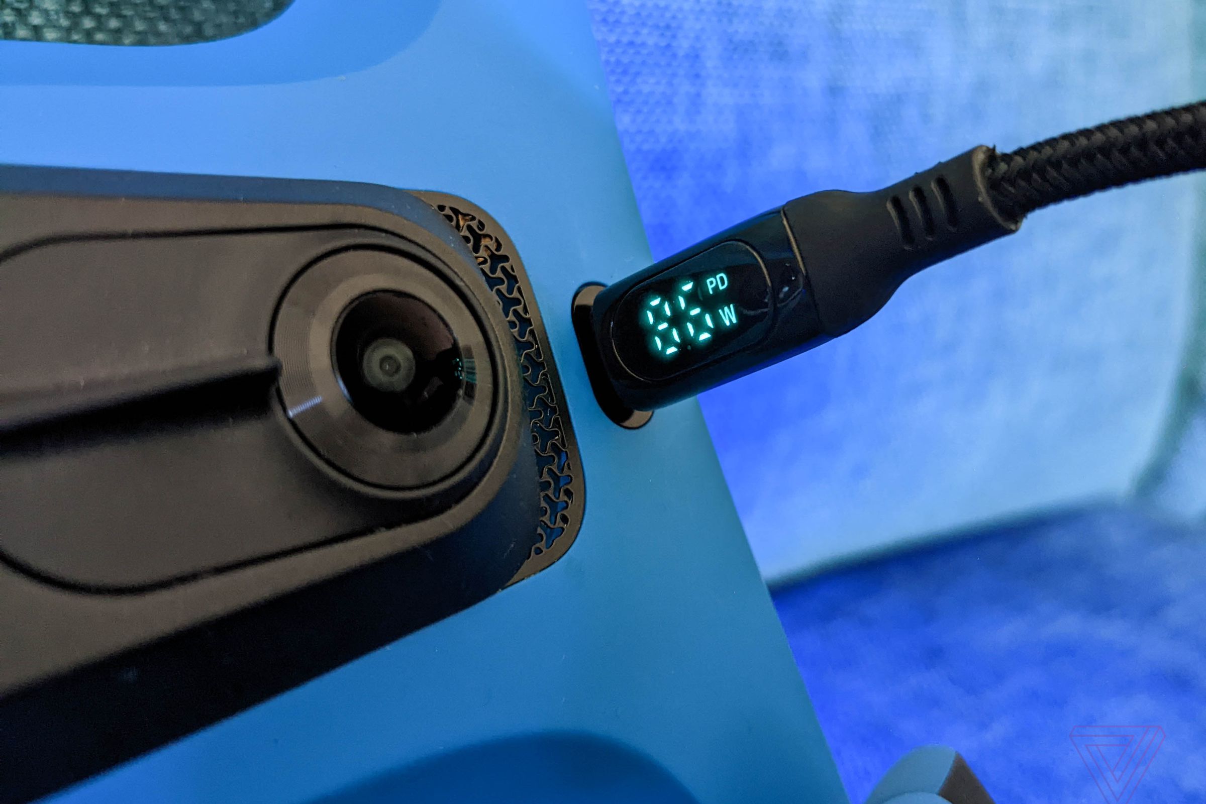 A USB-C power meter cable charging up a Skydio 2 drone.