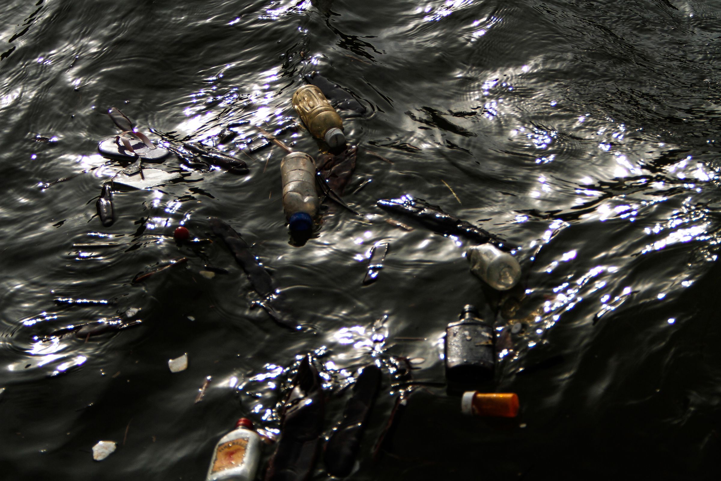 Garbage floats in the Flint River
