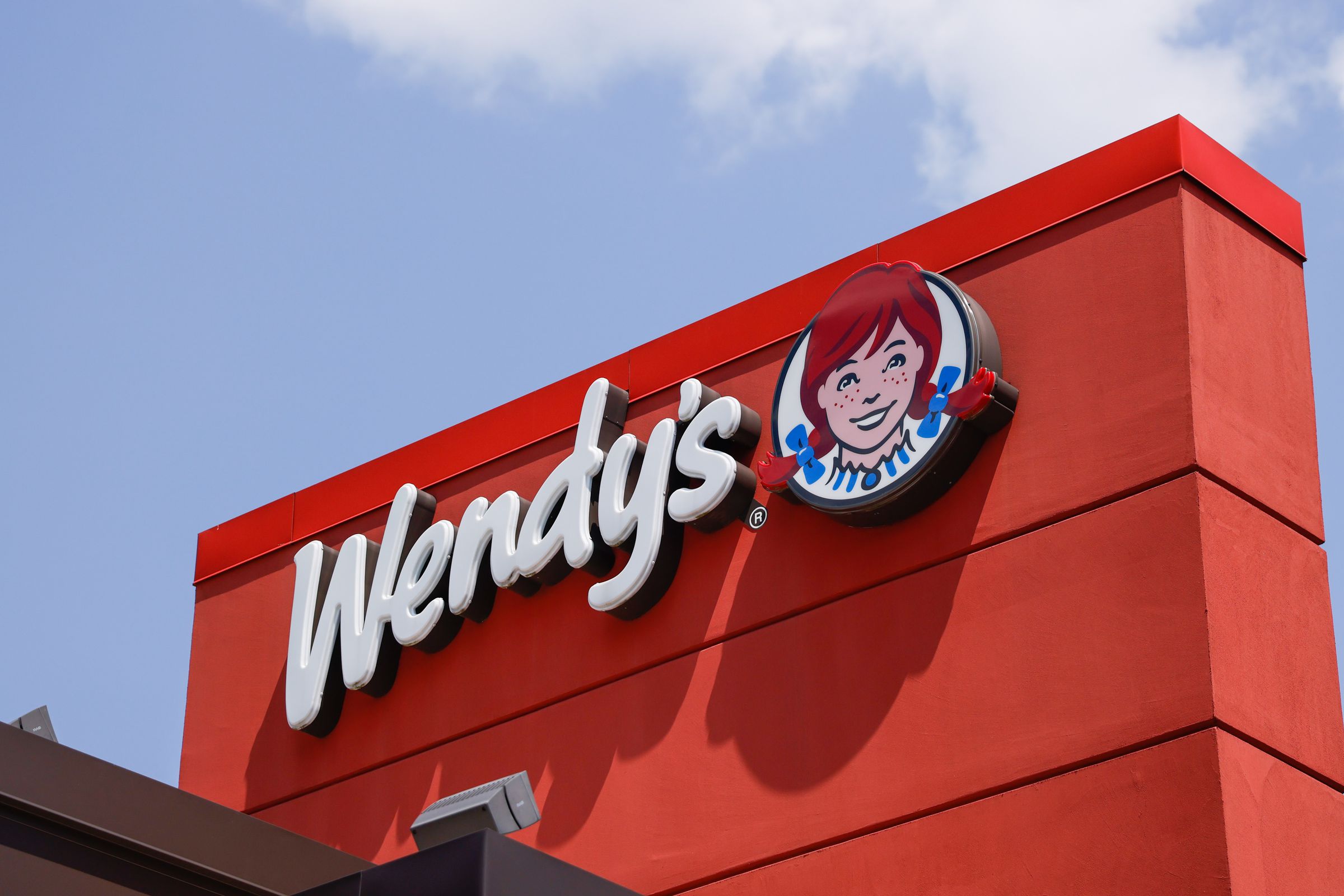 A photo showing a Wendy’s sign