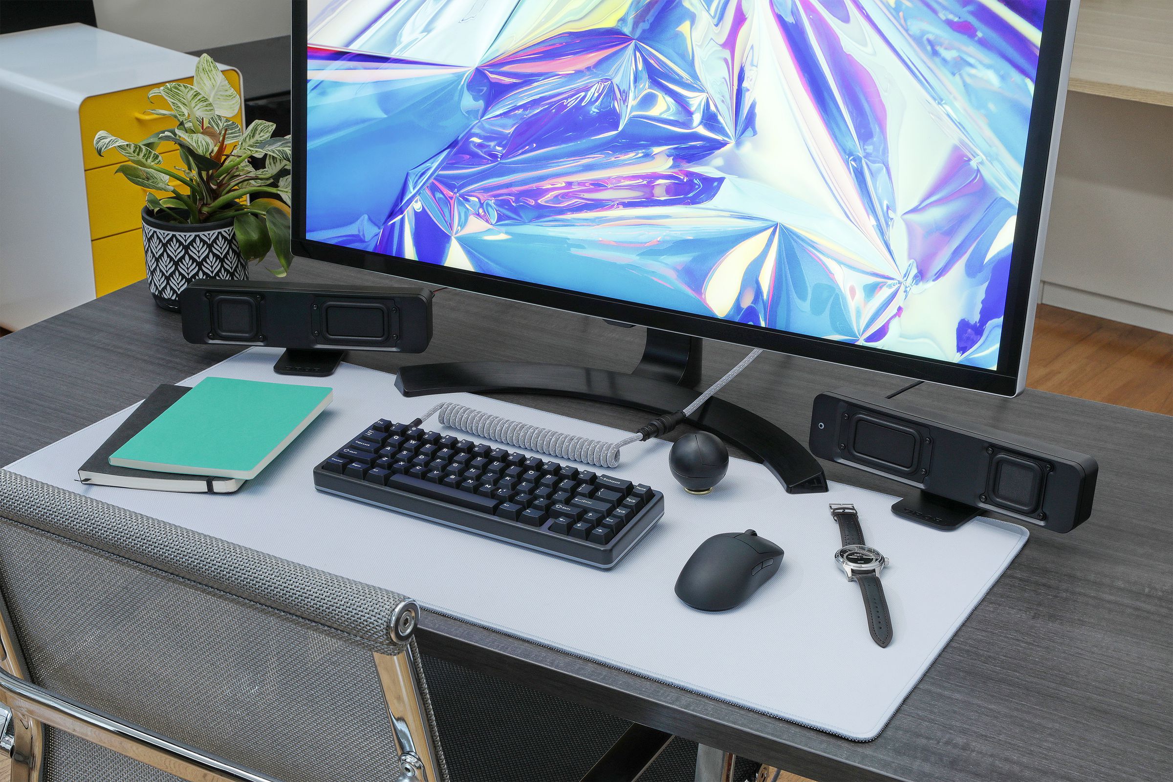 A desktop with a full PC setup including a keyboard, mouse, deskmat and the Drop BMR1 Nearfield Monitors.
