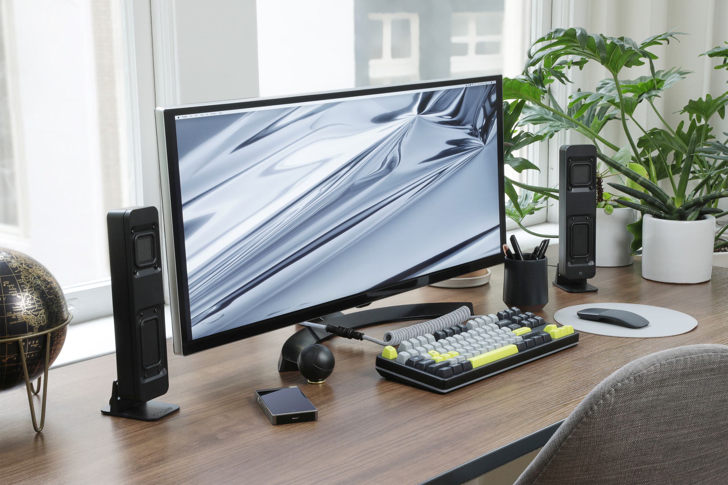 A desktop computer setup with the Drop BMR1 Nearfield Monitors placed in a horizontal orientation.