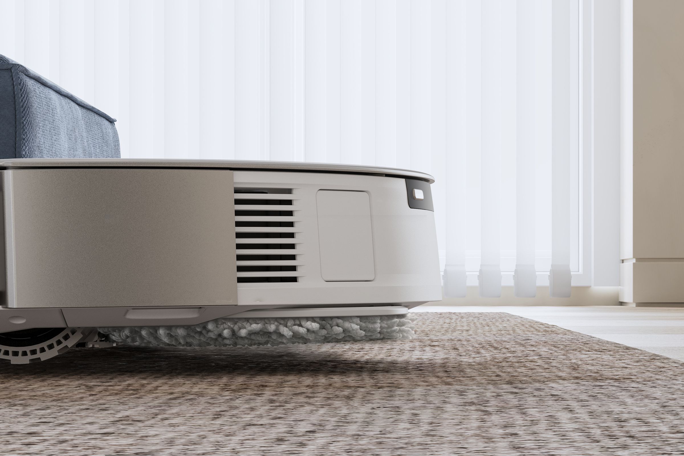 The latest robot vacuums have new tricks, like this Ecovacs model that lifts its mop 9mm off the floor.