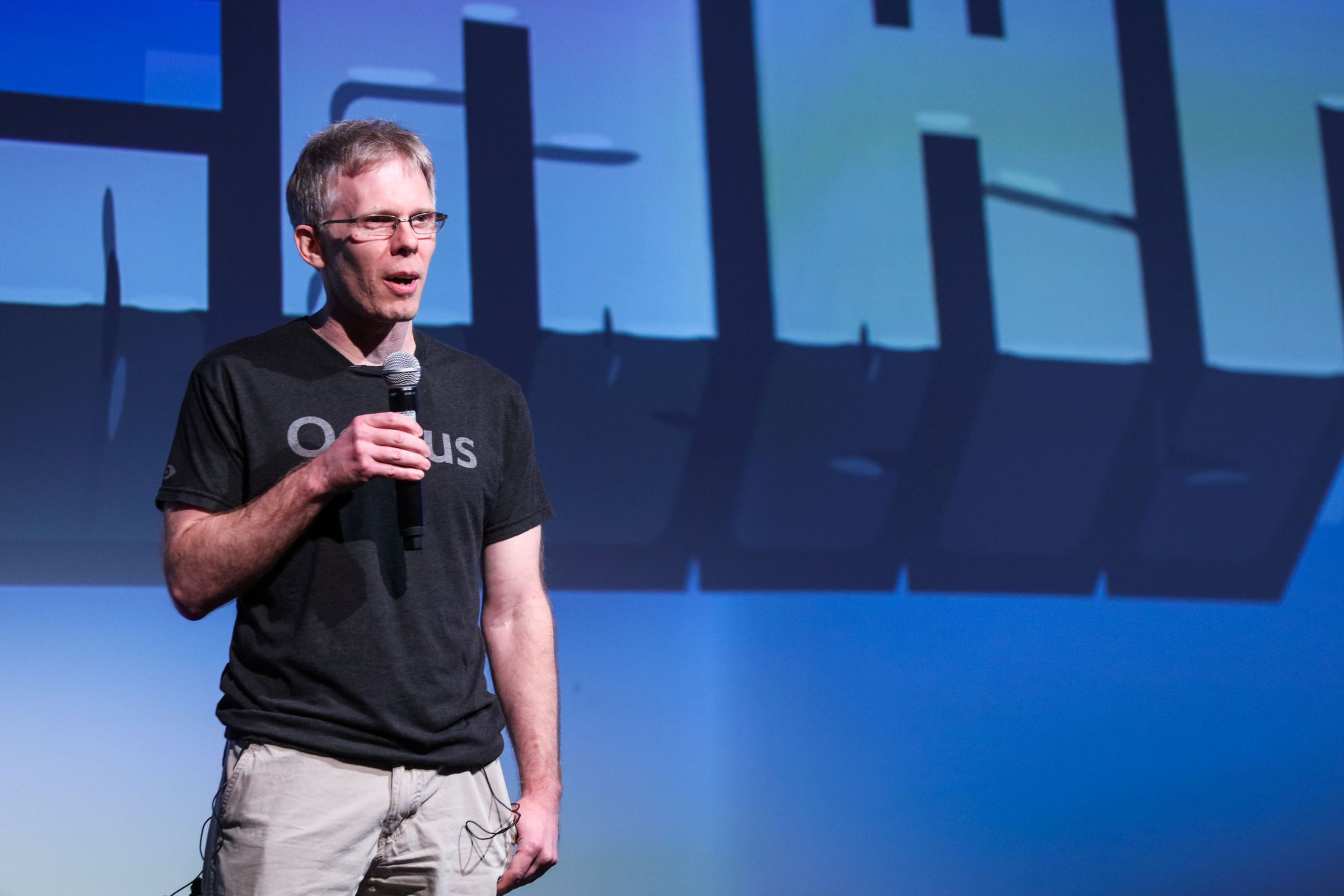 A photo of John Carmack onstage.