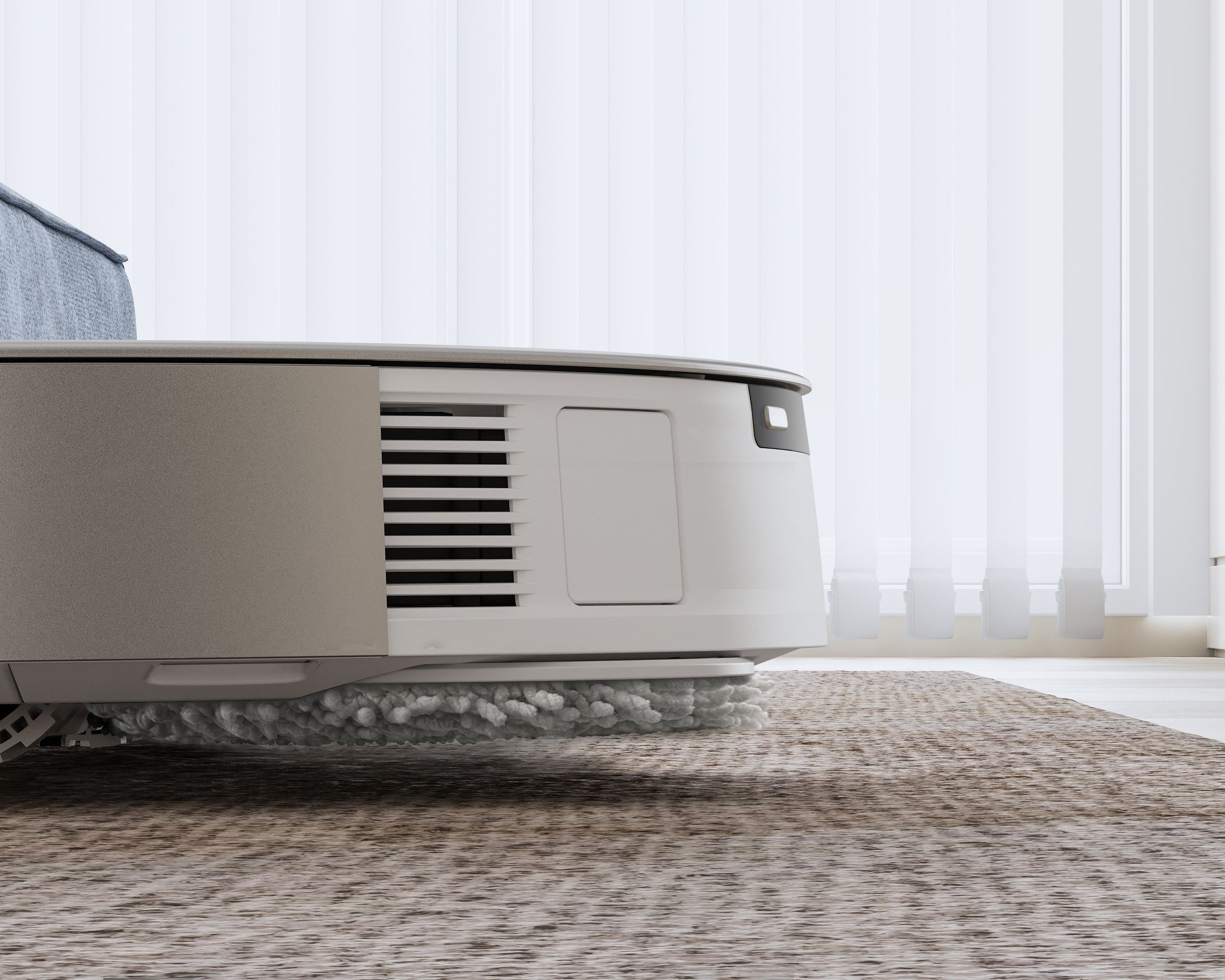 The latest robot vacuums have new tricks, like this Ecovacs model that lifts its mop 9mm off the floor.