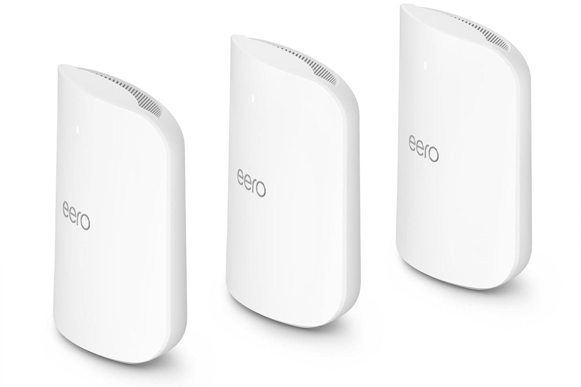A picture of the Eero Max 7 three-pack, all lined up from a three-quarter perspective and spaced apart.