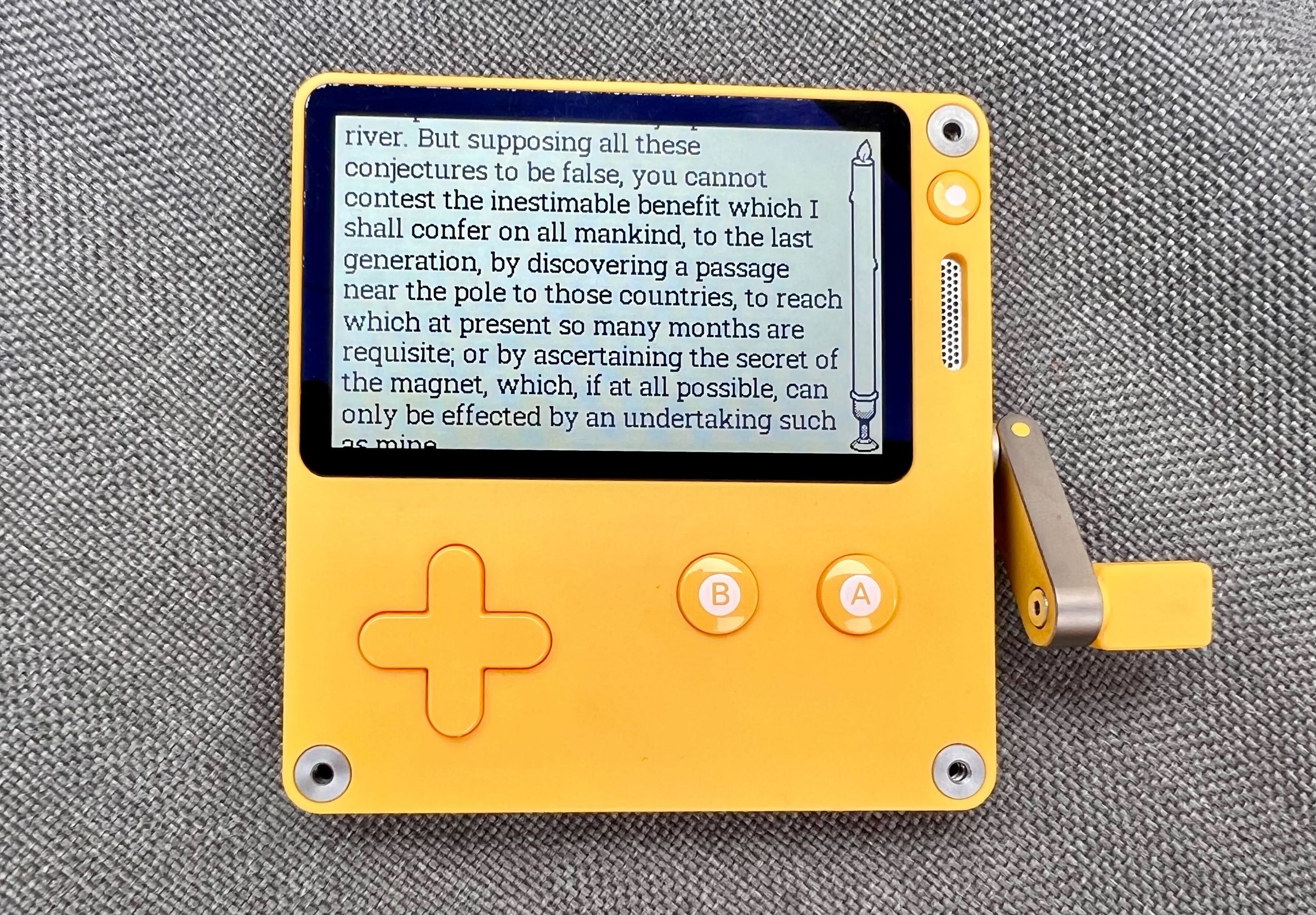 A photo of a book being read on the Playdate handheld.