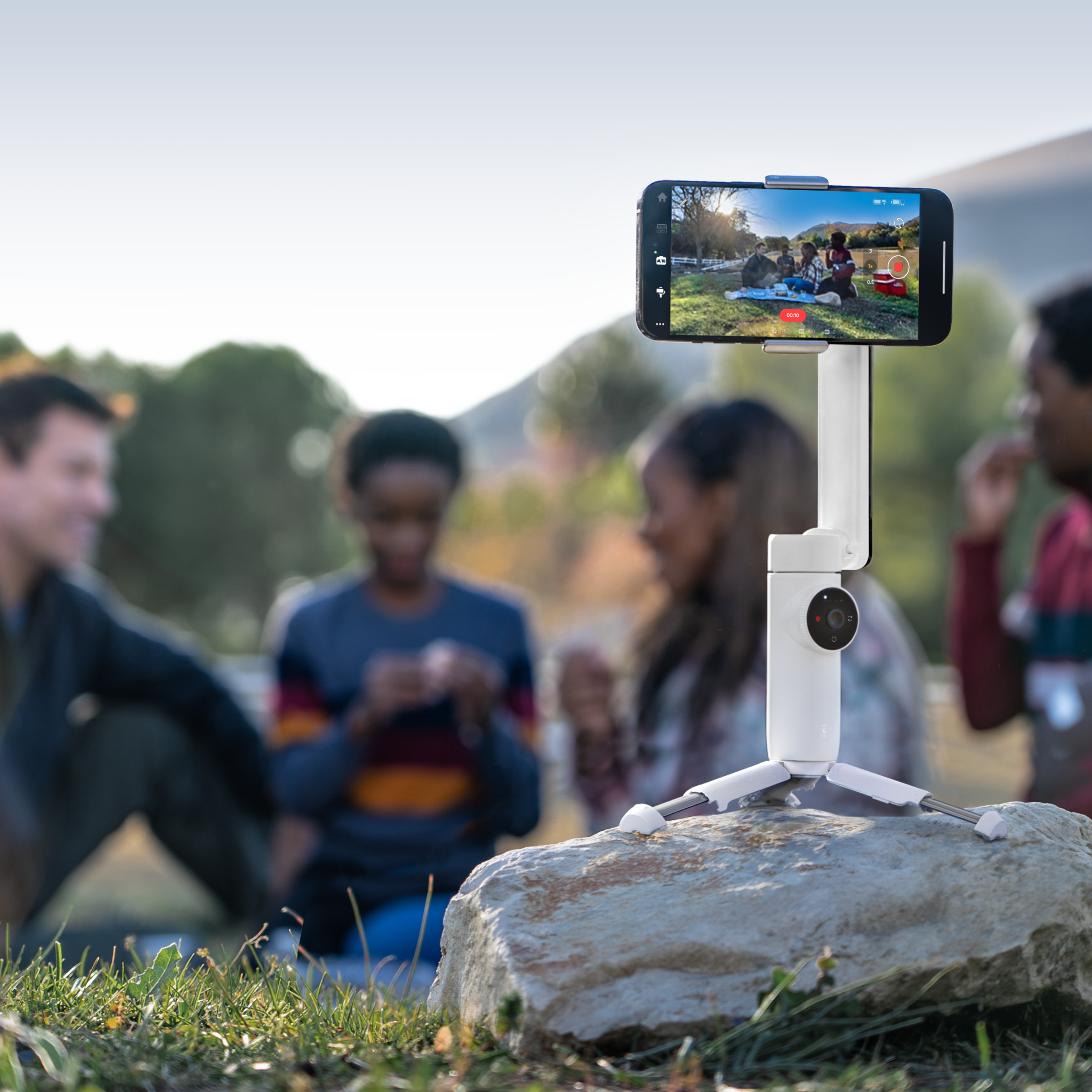 The Insta360 Flow stood on its tripod filming a scene.