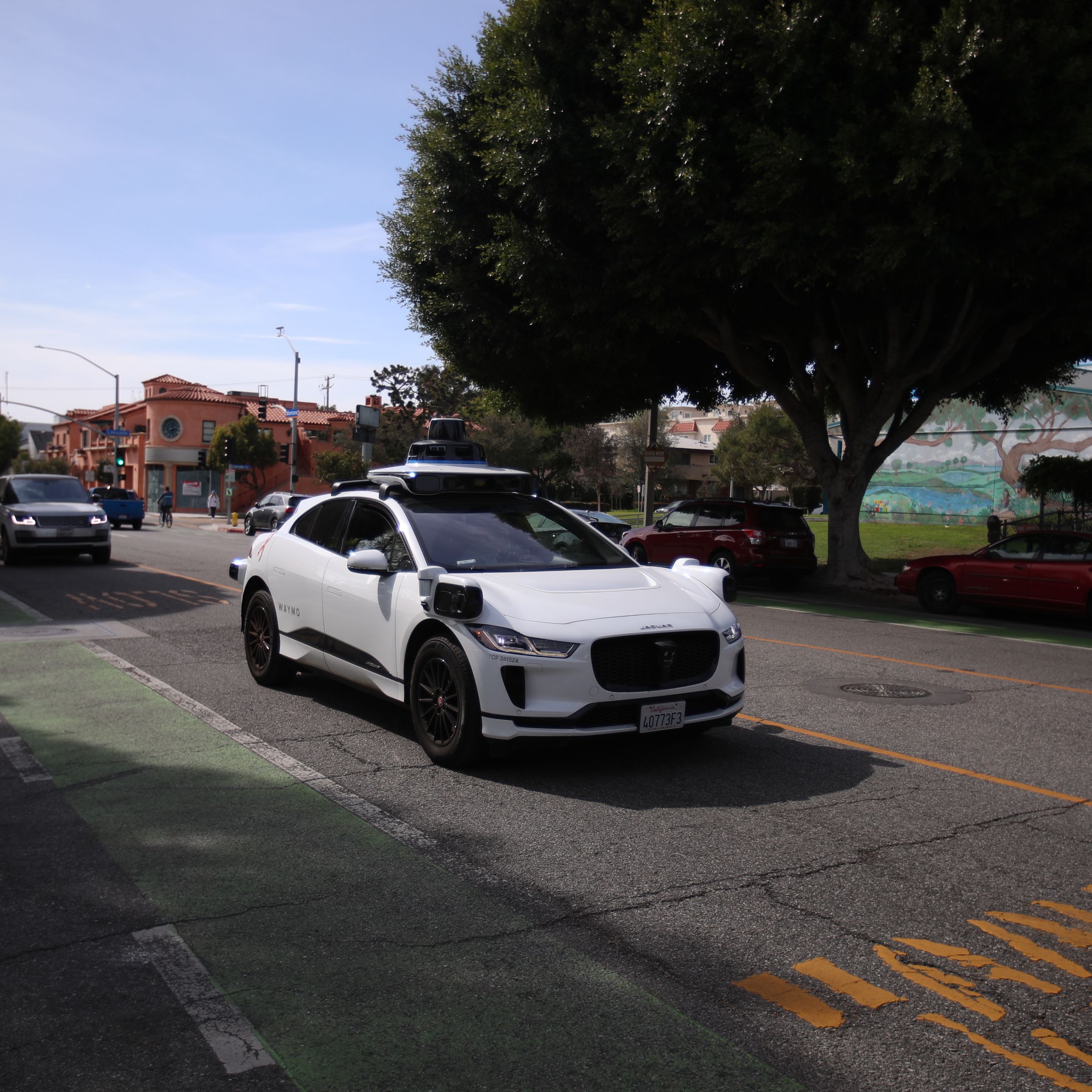 Self-driving Waymo cars on the road in Santa Monica