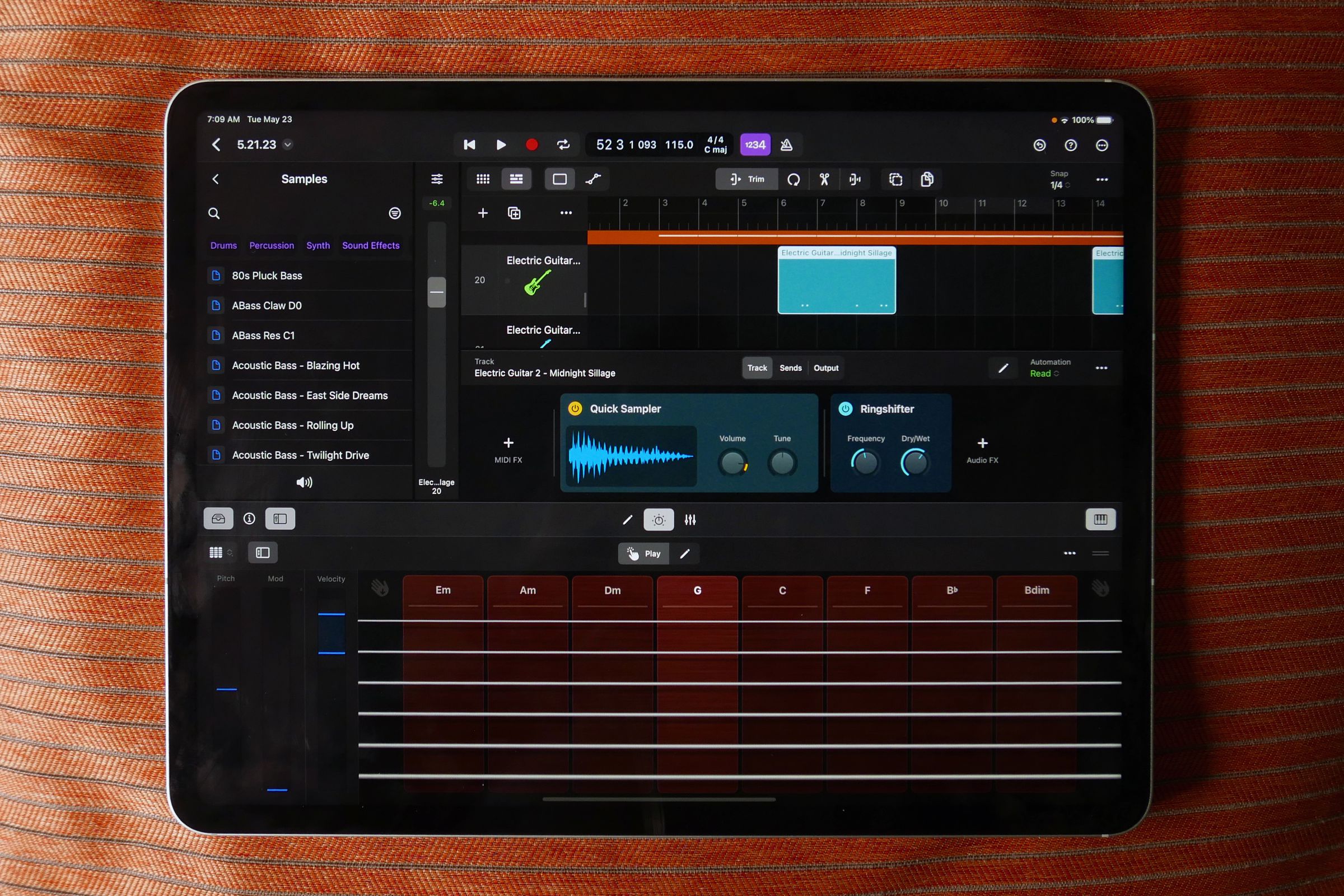 Logic Pro open on an iPad with a virtual fretboard open