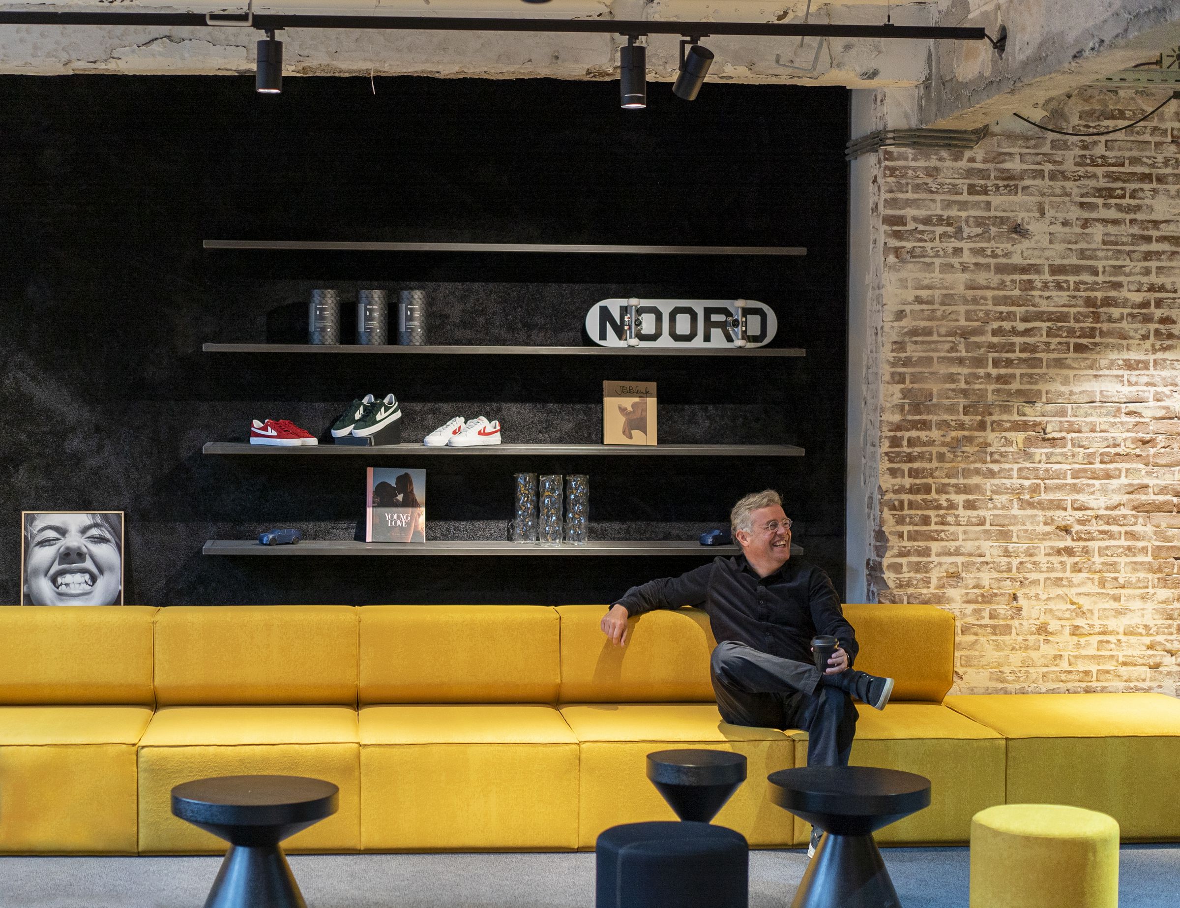 Lynk & Co CEO Alain Visser looking very relaxed inside Amsterdam Club. All items are for sale, including the sectional. 