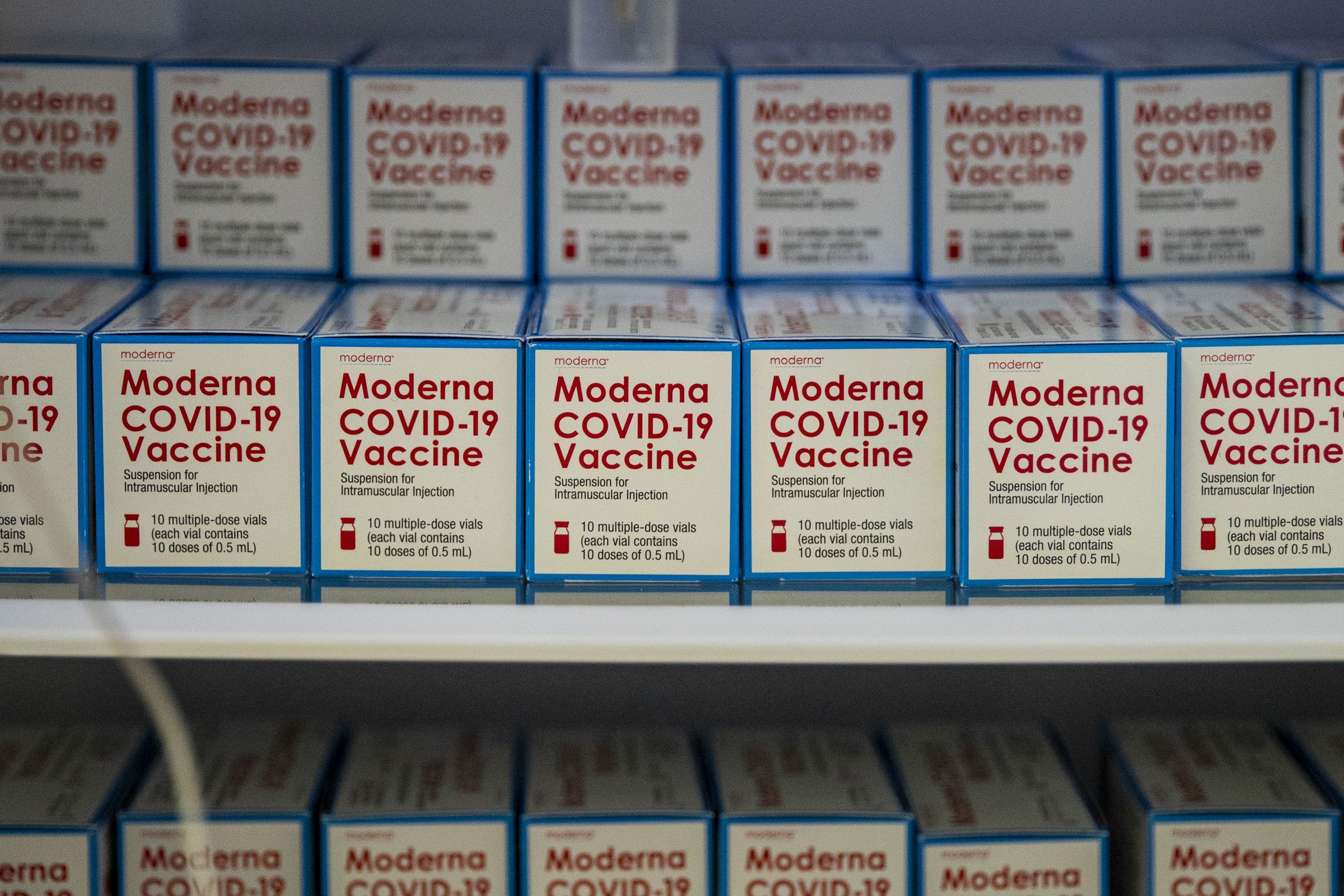 Boxes of the Moderna COVID-19 vaccine sitting in freezers...
