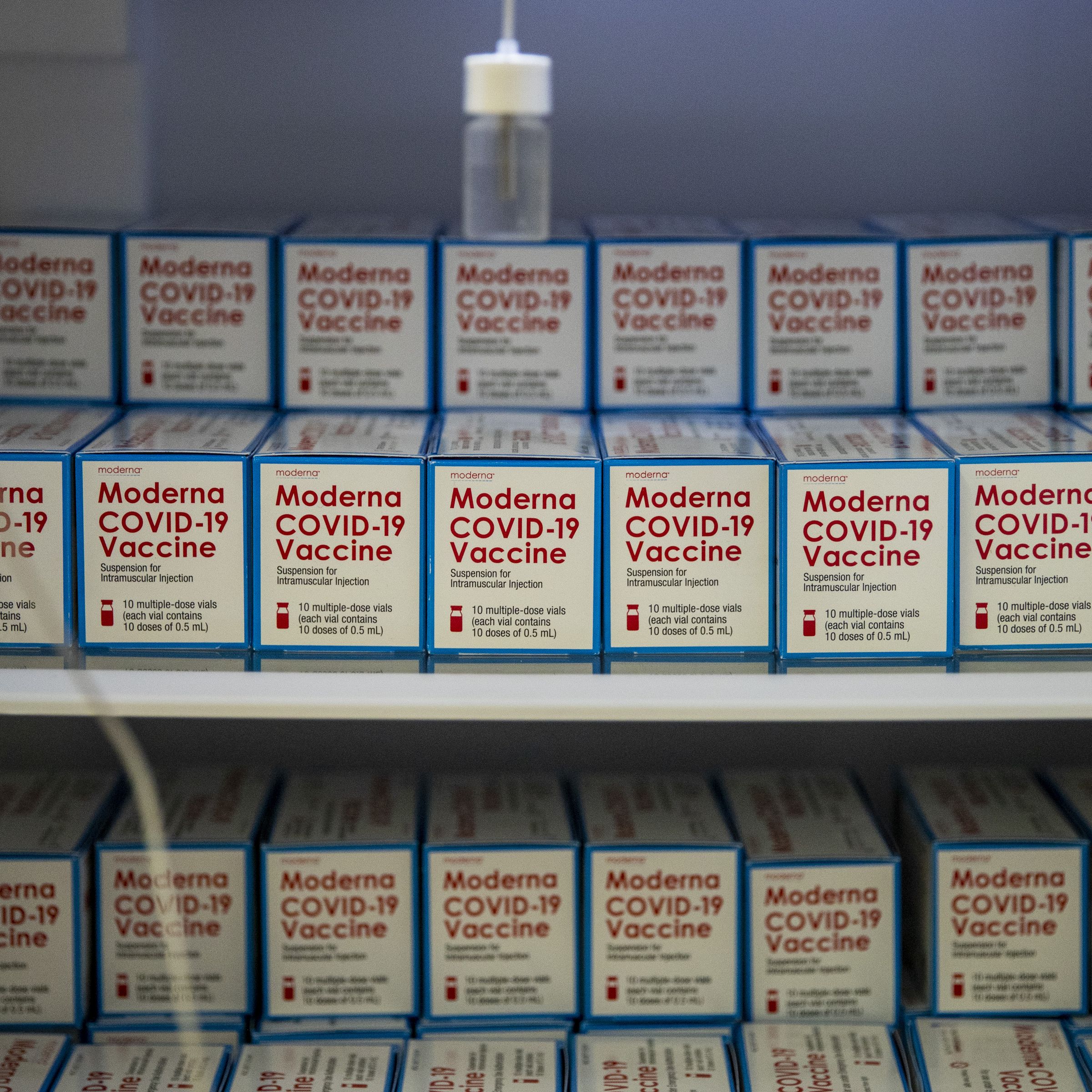 Boxes of the Moderna COVID-19 vaccine sitting in freezers...