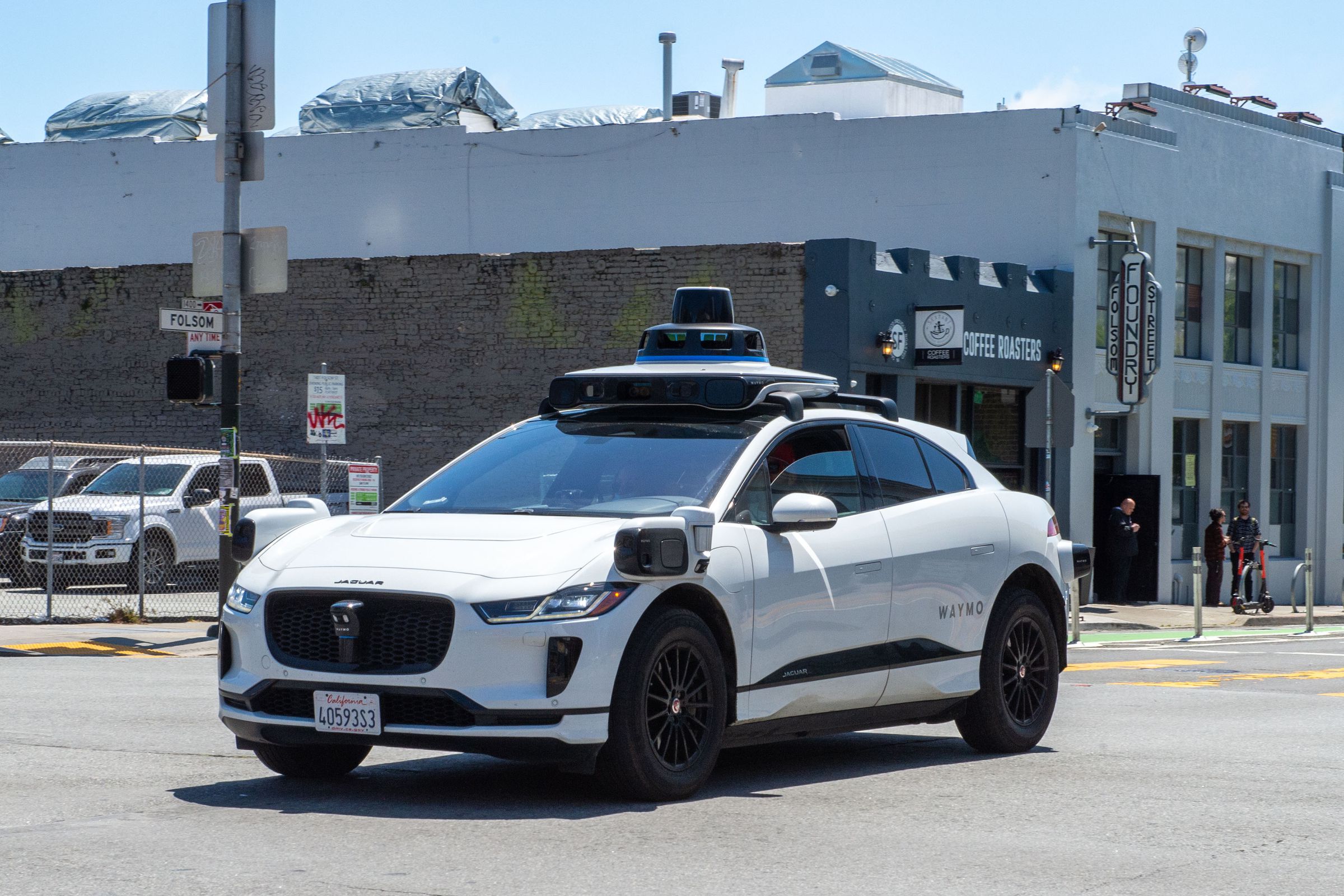 A Waymo car driving on a road in San Francisco.