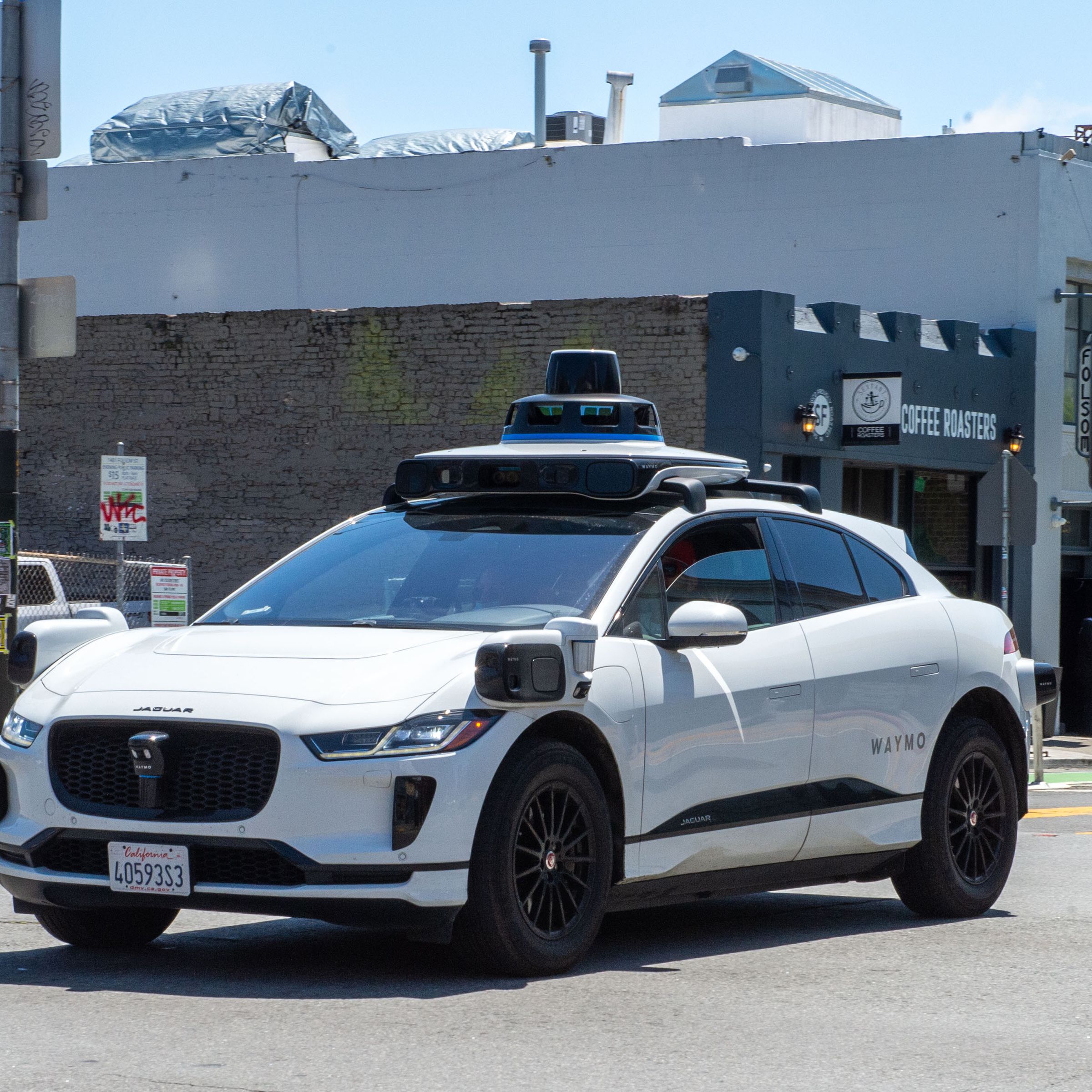 A Waymo car driving on a road in San Francisco.