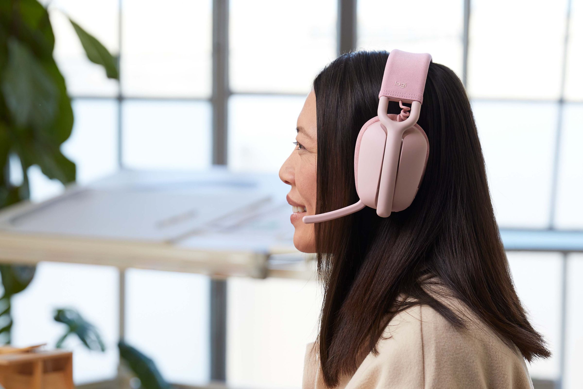 A person using the Zone Vibe 100 headset.