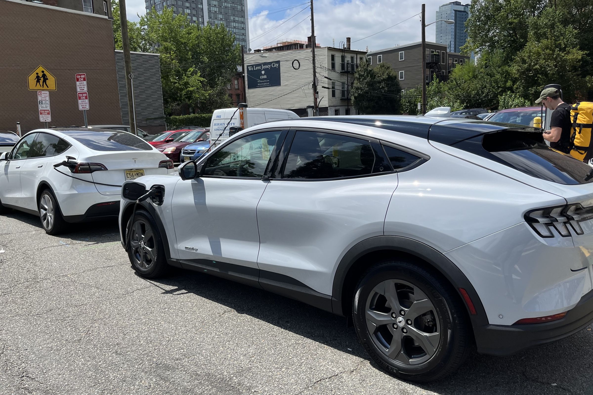 A Mustang Mach-E and Tesla Model Y sharing a ChargePoint.