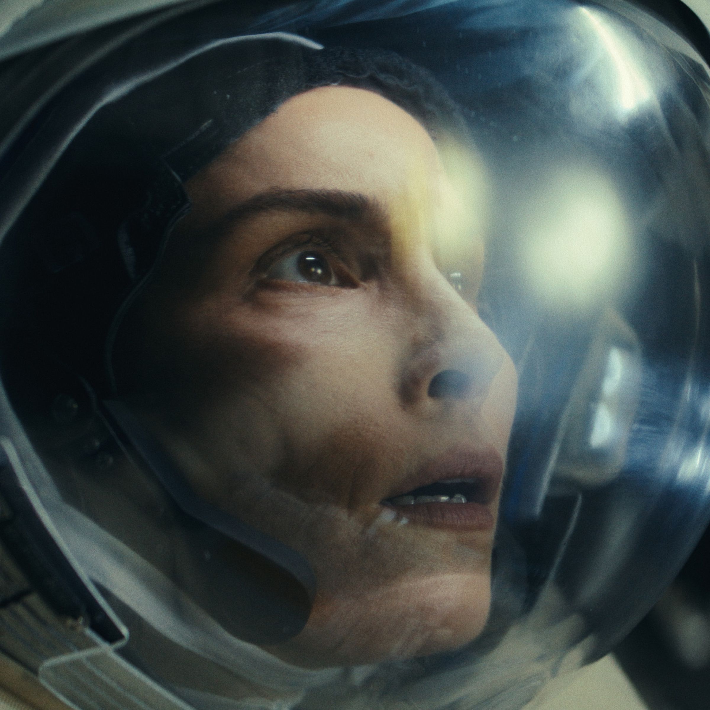 Picture of Noomi Rapace wearing an astronaut’s helmet, looking at something anxiously&nbsp;in a scene from the sci-fi TV series Constellation.