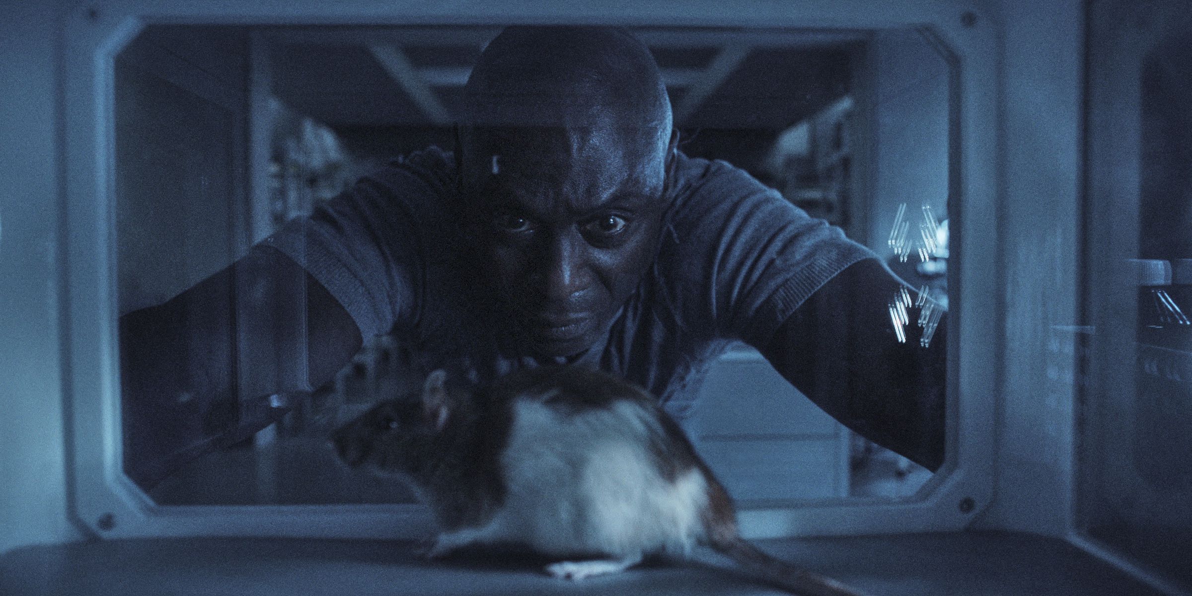 Albert Wesker gazing at a lab rat