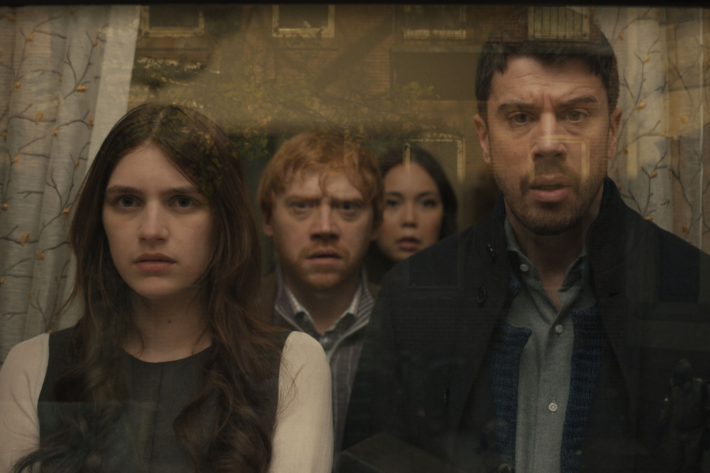A photo of Nell Tiger Free, Rupert Grint, Katie Lee Hill, and Toby Kebbell in season 4 of Servant on Apple TV Plus.