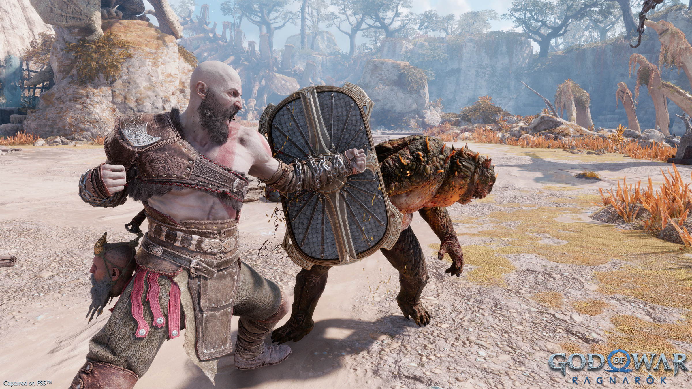 Kratos blocks an attack in God of War: Ragnarök.