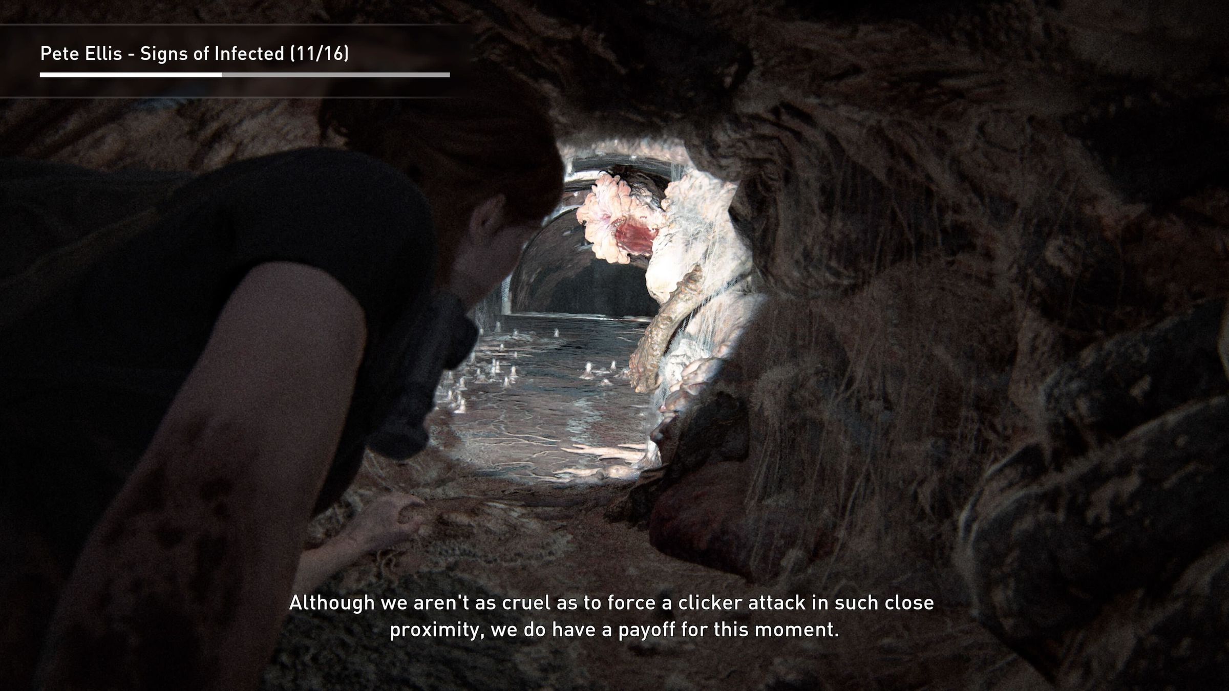 A screenshot featuring Ellie crawling through a sewer in a deleted scene from The Last of Us Part II.