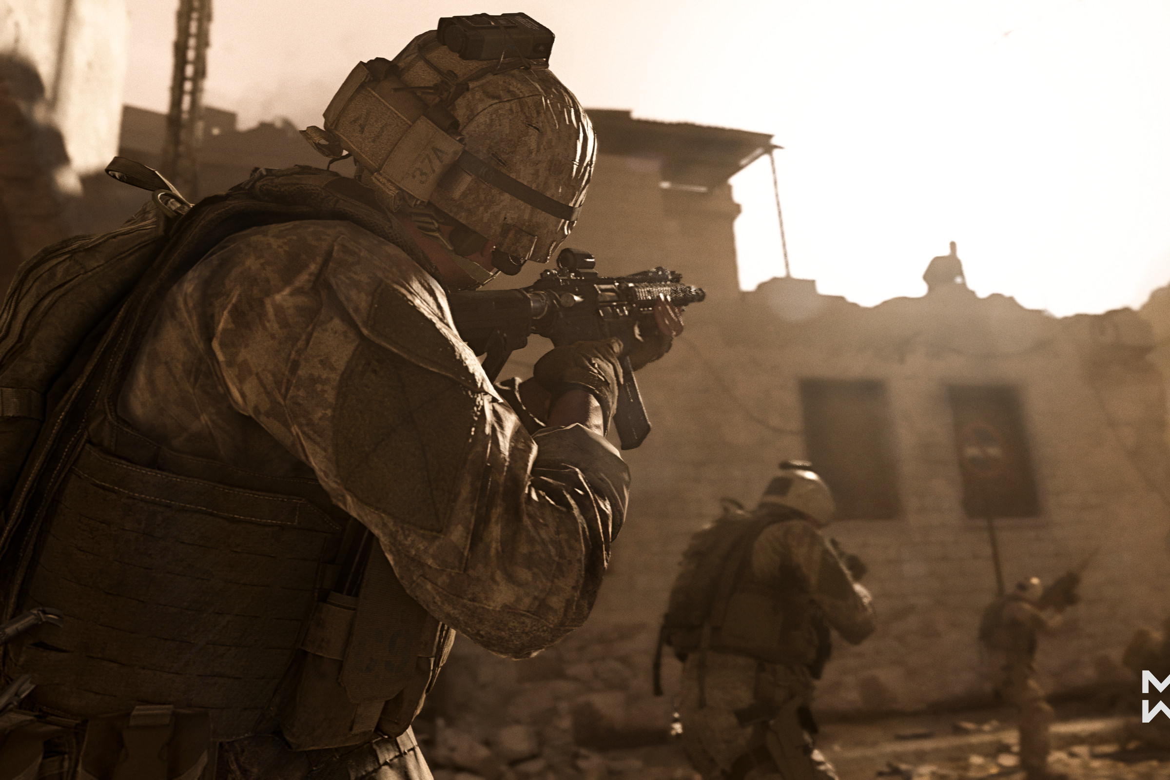 Promotional image from Call of Duty: Modern Warfare featuring a soldier in fatigues and helmet aiming a gun as a squad of soldiers patrol a bomb-out city street