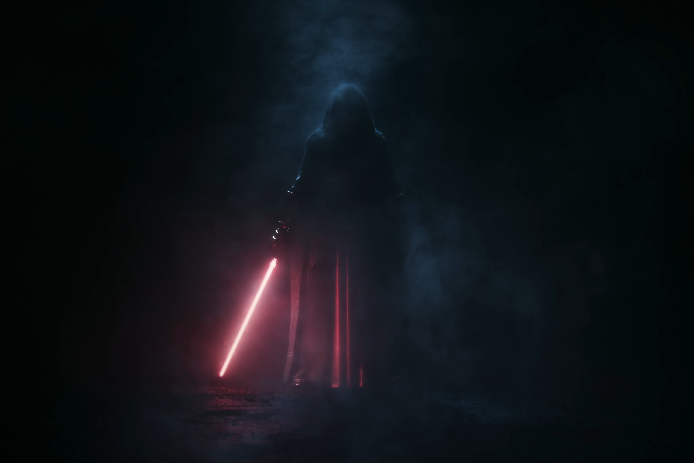 A cloaked figure wields a red lightsaber.