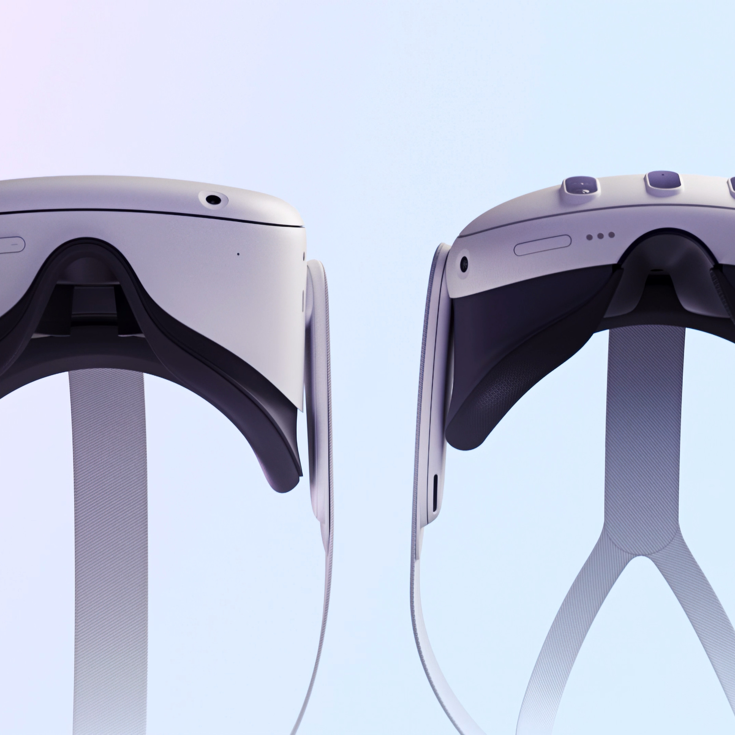 Side-by-side view from the bottom of both the Meta Quest 2 and Quest 3 headsets showing the new version’s slimmer design.