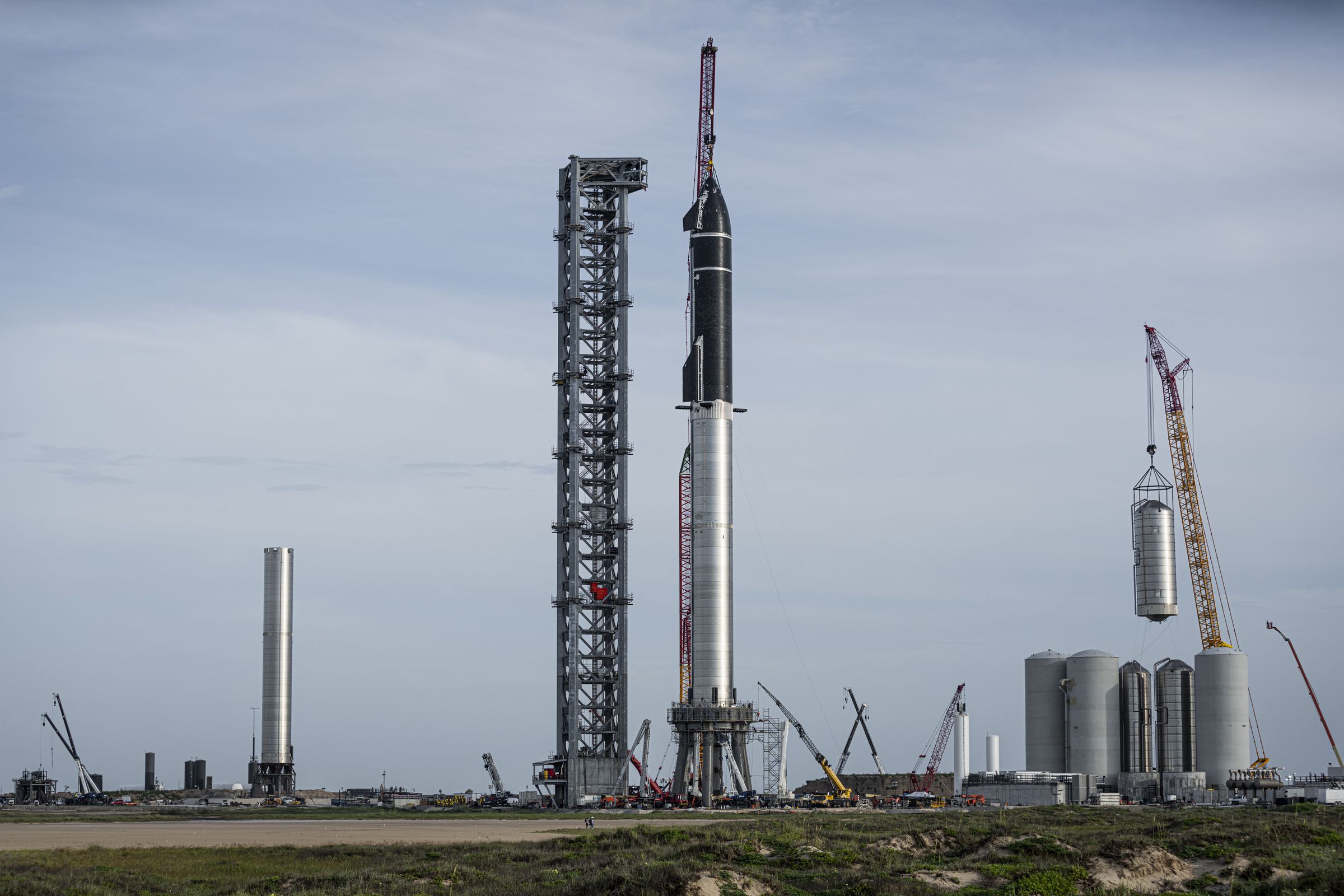 SpaceX stacking its Starship spacecraft on top of a Super Heavy booster at the company’s launch site in Boca Chica, Texas.