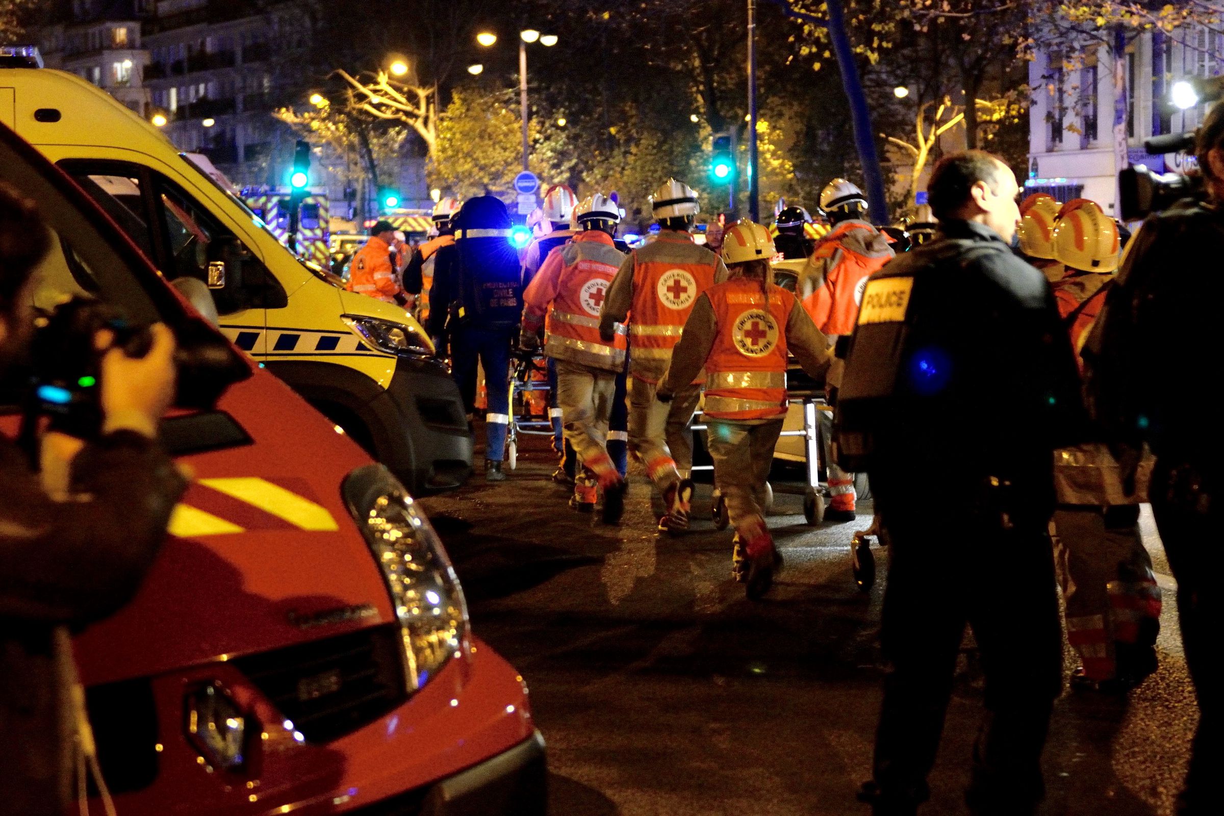 Rescue workers enter a triage area near Bataclan.